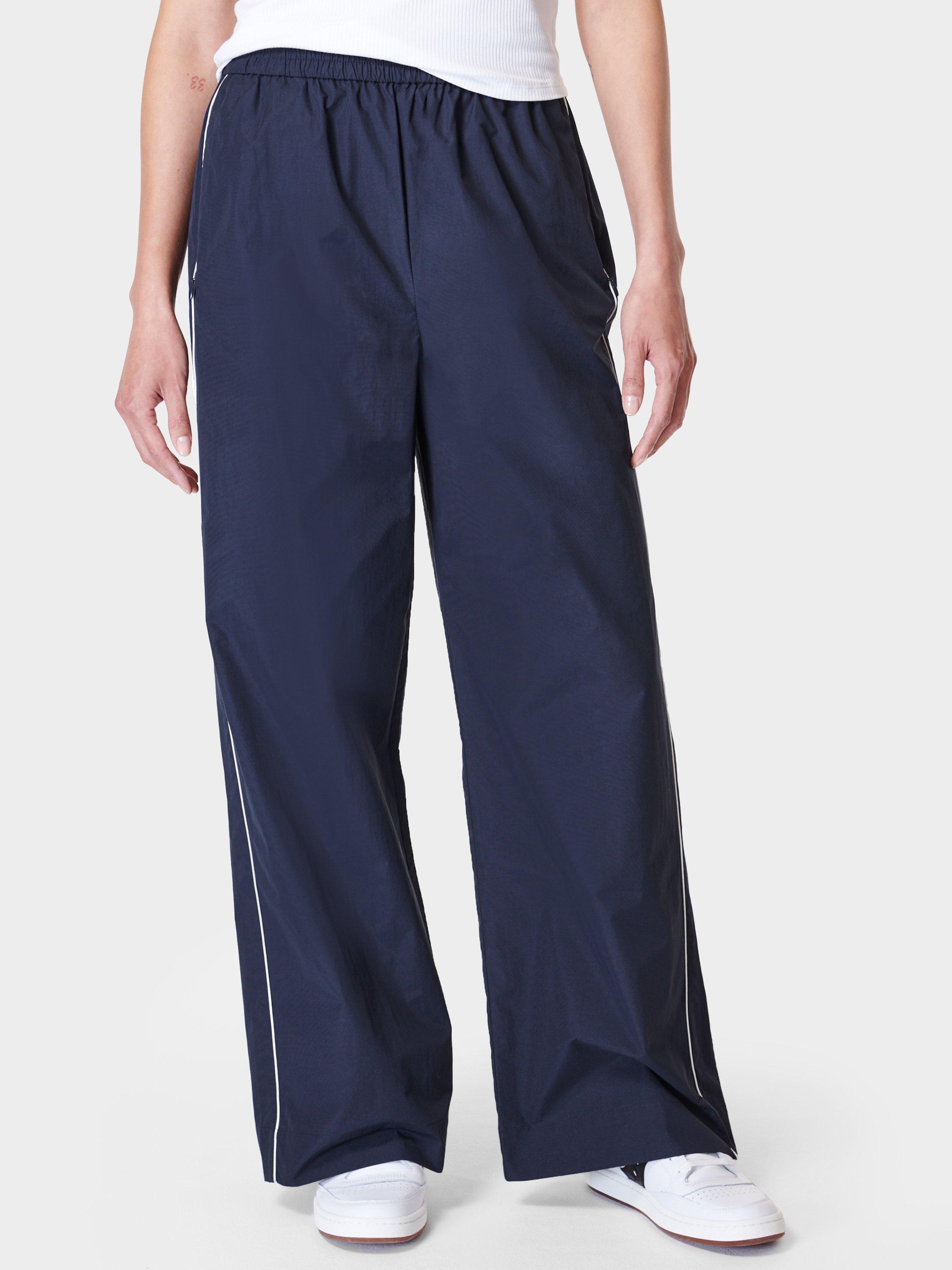 Product image 1 of 6, which shows Sweaty Betty Shell Wide Leg Trousers, Navy Blue, XS