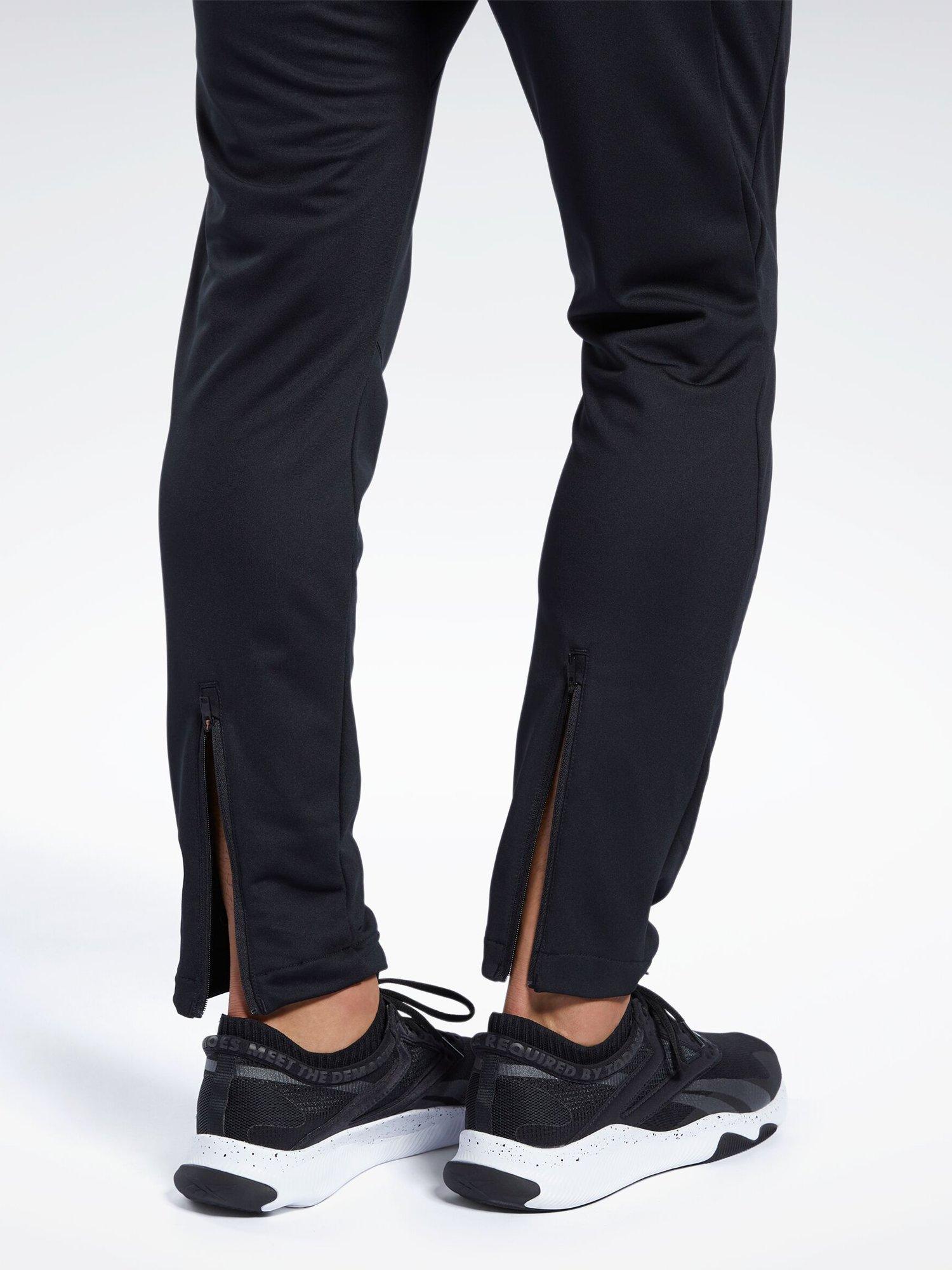 Product image 7 of 8, which shows Reebok Men's Id Train Slim Fit Track Pants, Black, S