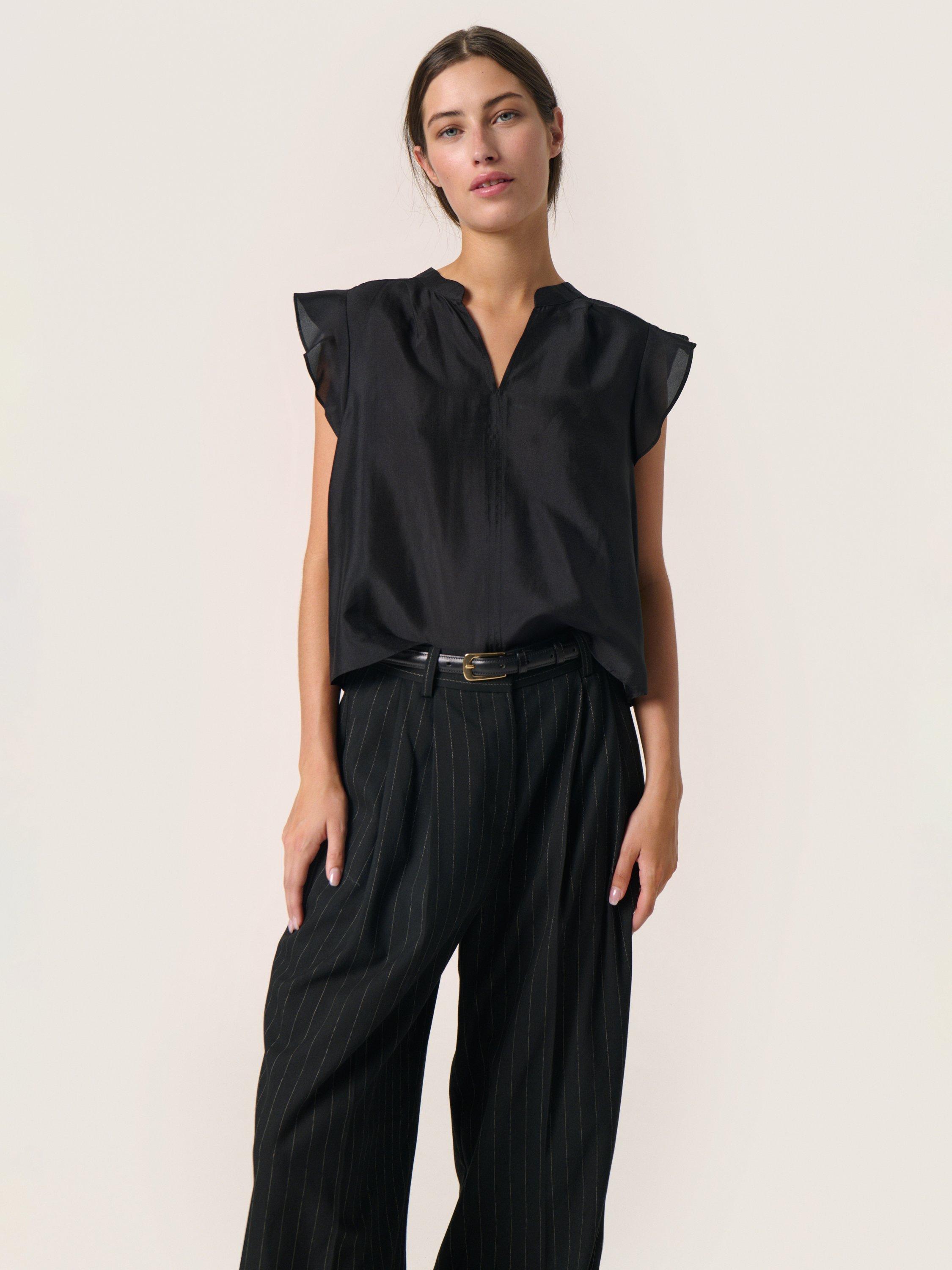Product image 1 of 6, which shows Soaked In Luxury Karoline Frill Sleeve Top, Black, M