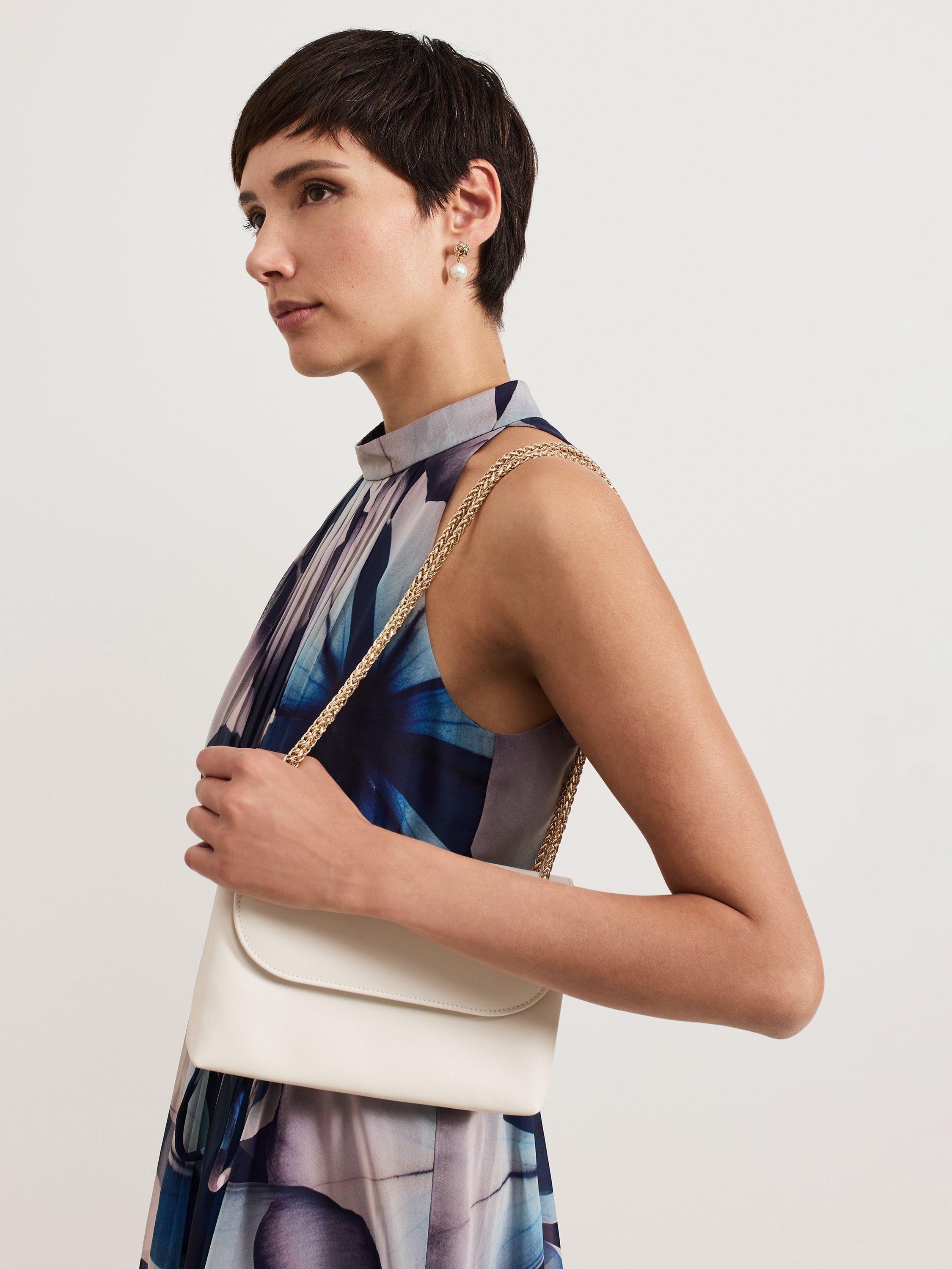 Product image 6 of 9, which shows Phase Eight Leather Clutch Bag, Ivory, One Size