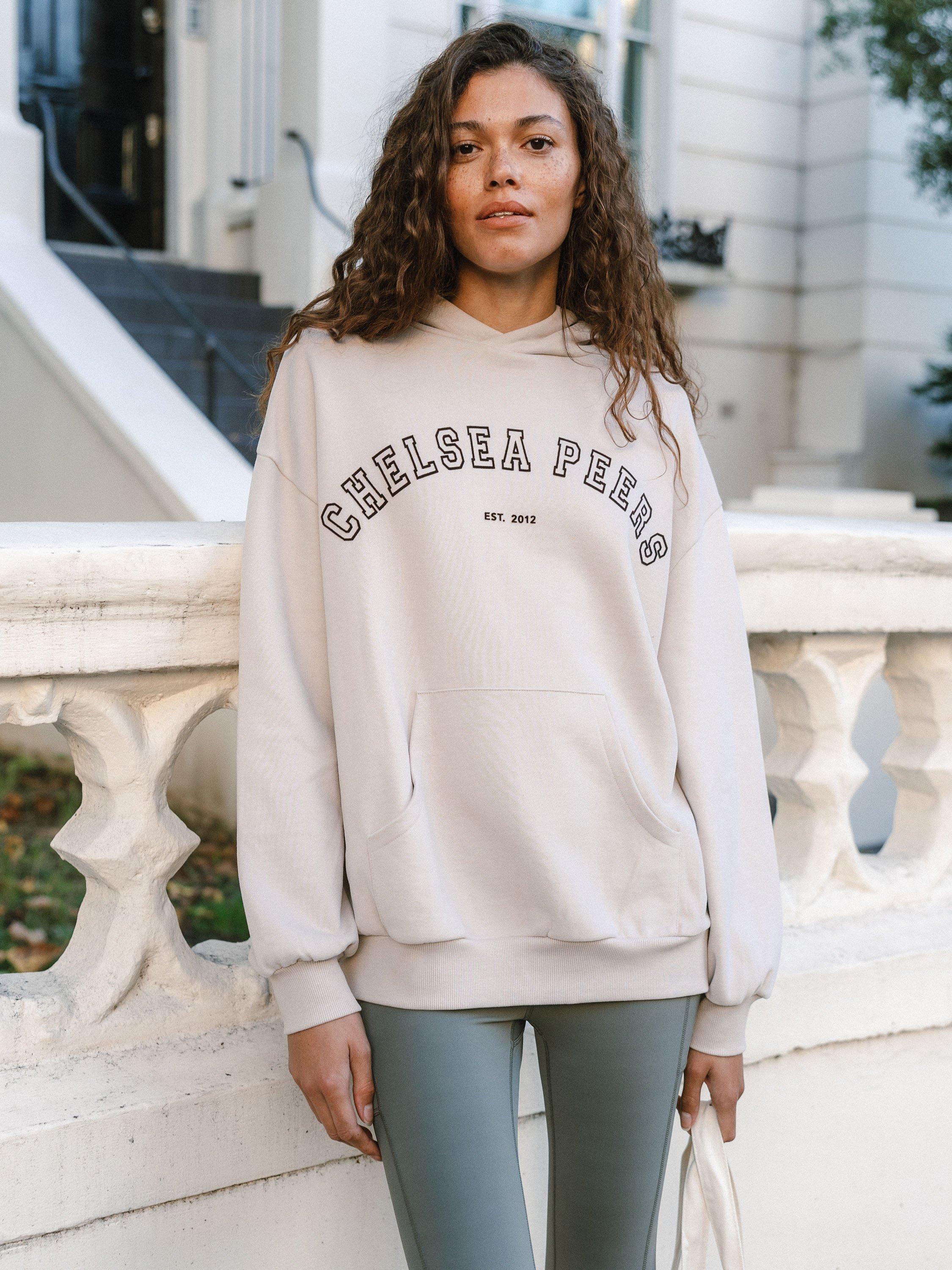 Product image 1 of 6, which shows Chelsea Peers Flocked Logo Organic Cotton Rich Hoodie, Beige, 18