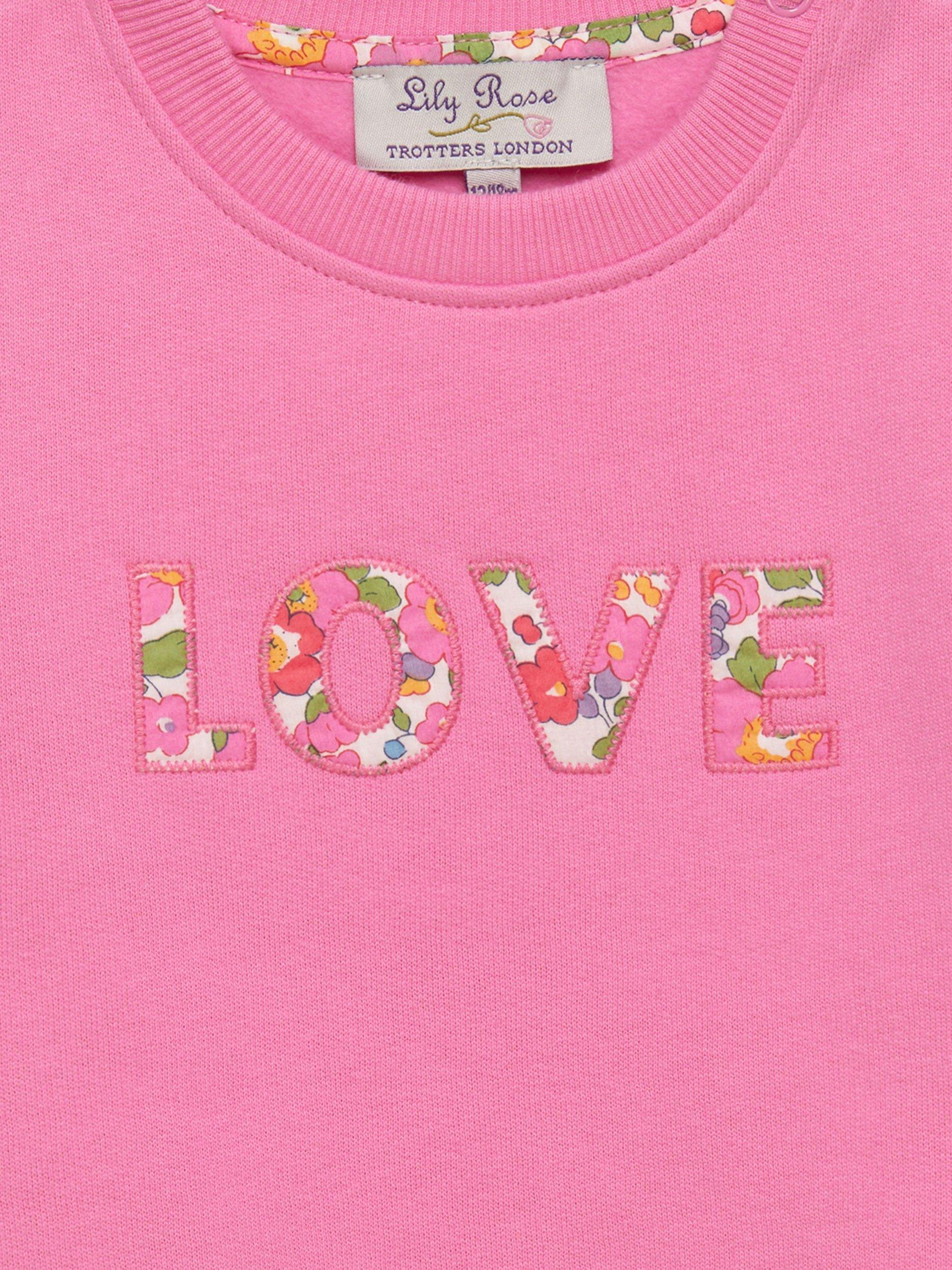 Product image 3 of 3, which shows Trotters Baby Betsy Print Love Sweatshirt, Pink/Multi, 3-6 months