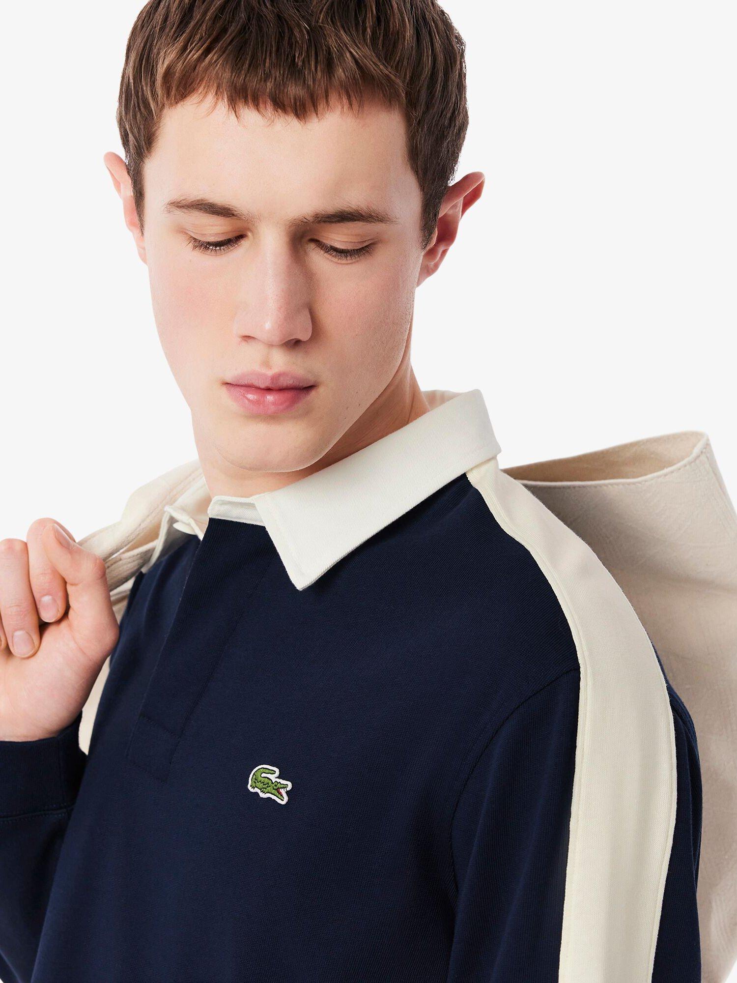 Product image 4 of 7, which shows Lacoste Cotton Regular Fit Long Sleeve Tennis Legacy Polo Shirt, Navy Blue, M