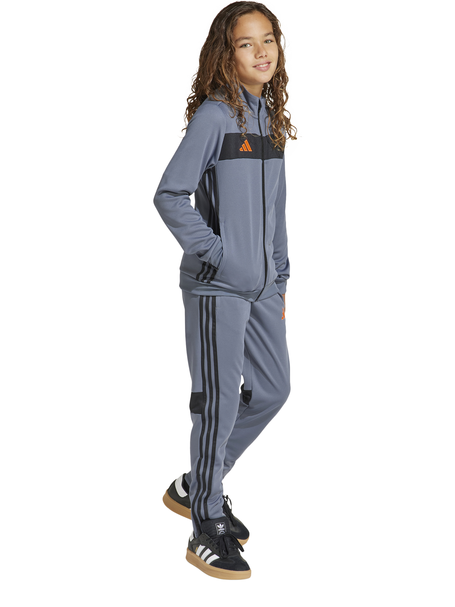 Product image 1 of 8, which shows adidas Kids' Tiro Tracksuit, Onix/Orange, 7-8 years