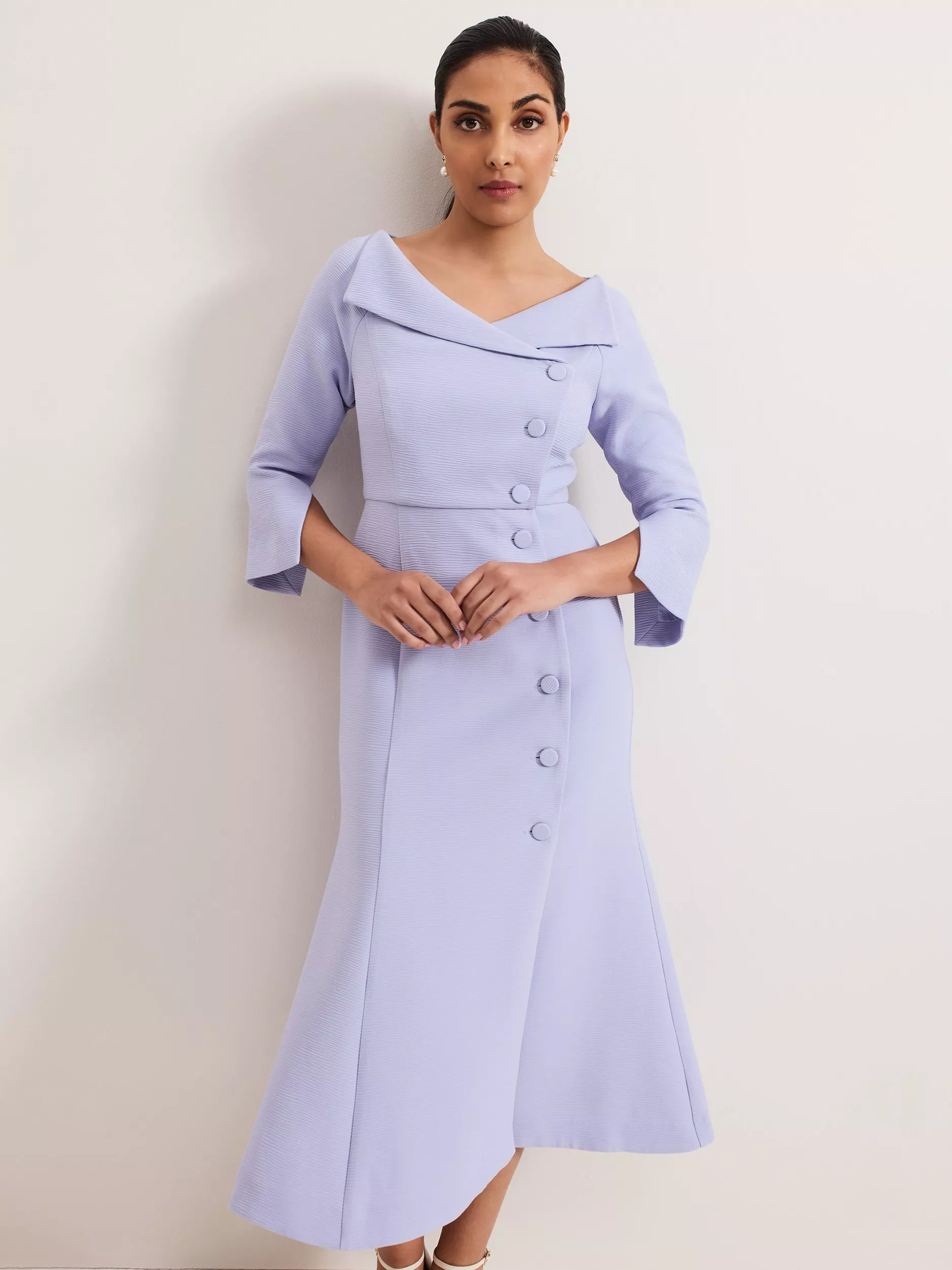 woman wearing a purple occasion dress