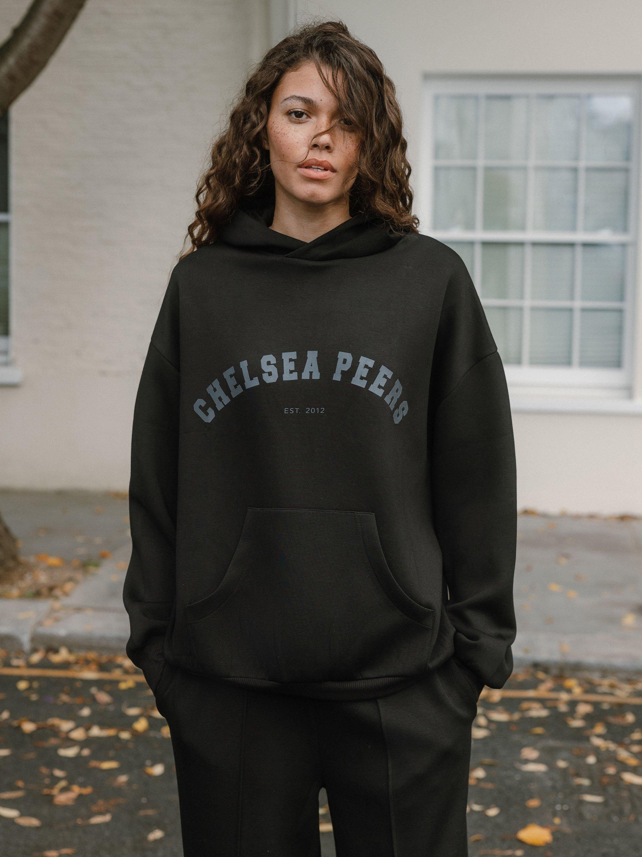 Product image 1 of 6, which shows Chelsea Peers Scuba Logo Hoodie, Black, 18