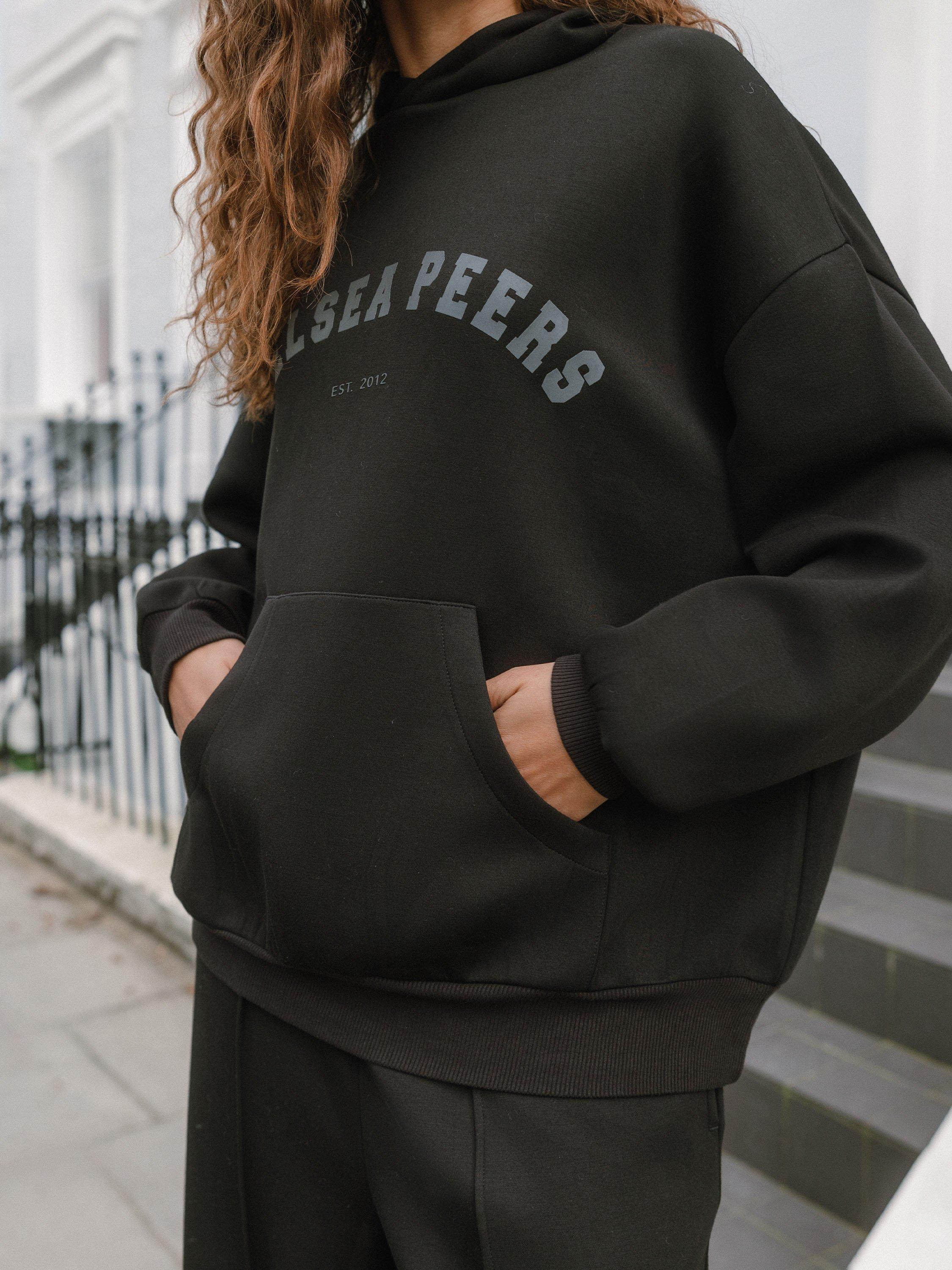 Product image 3 of 6, which shows Chelsea Peers Scuba Logo Hoodie, Black, 18