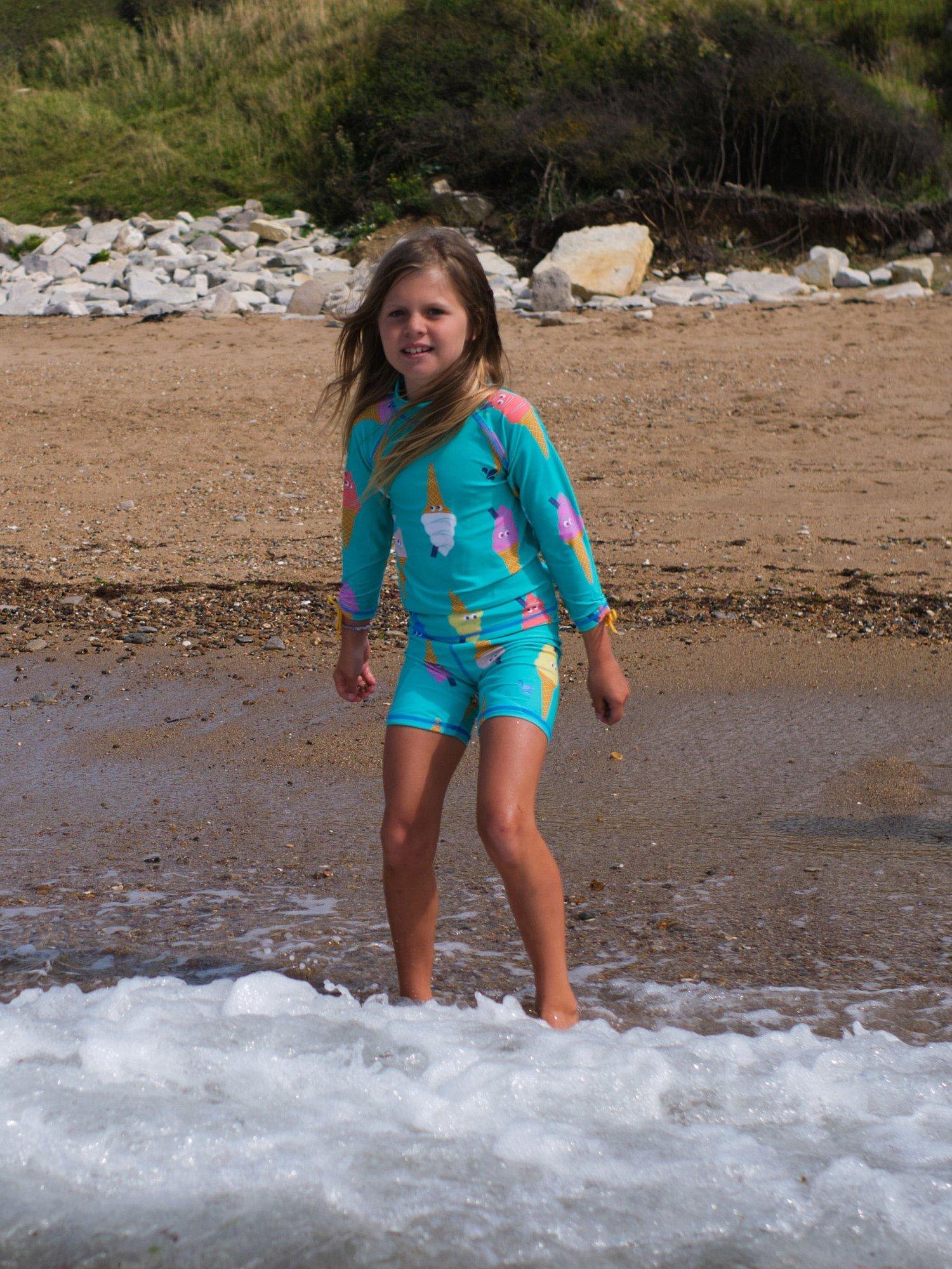 Product image 2 of 5, which shows Muddy Puddles Kids' UV Ice Cream Print Rash Vest & Shorts Surf Set, Green, 12-18 months