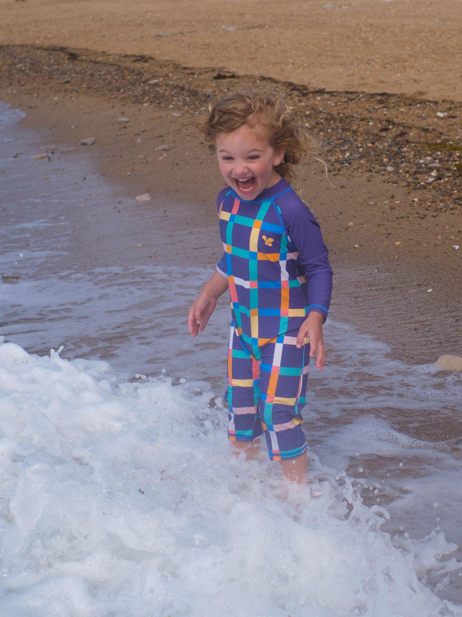 Product image 2 of 5, which shows Muddy Puddles Kids' UV Check Long Sleeve Surf Suit, Multi, 0-6 months