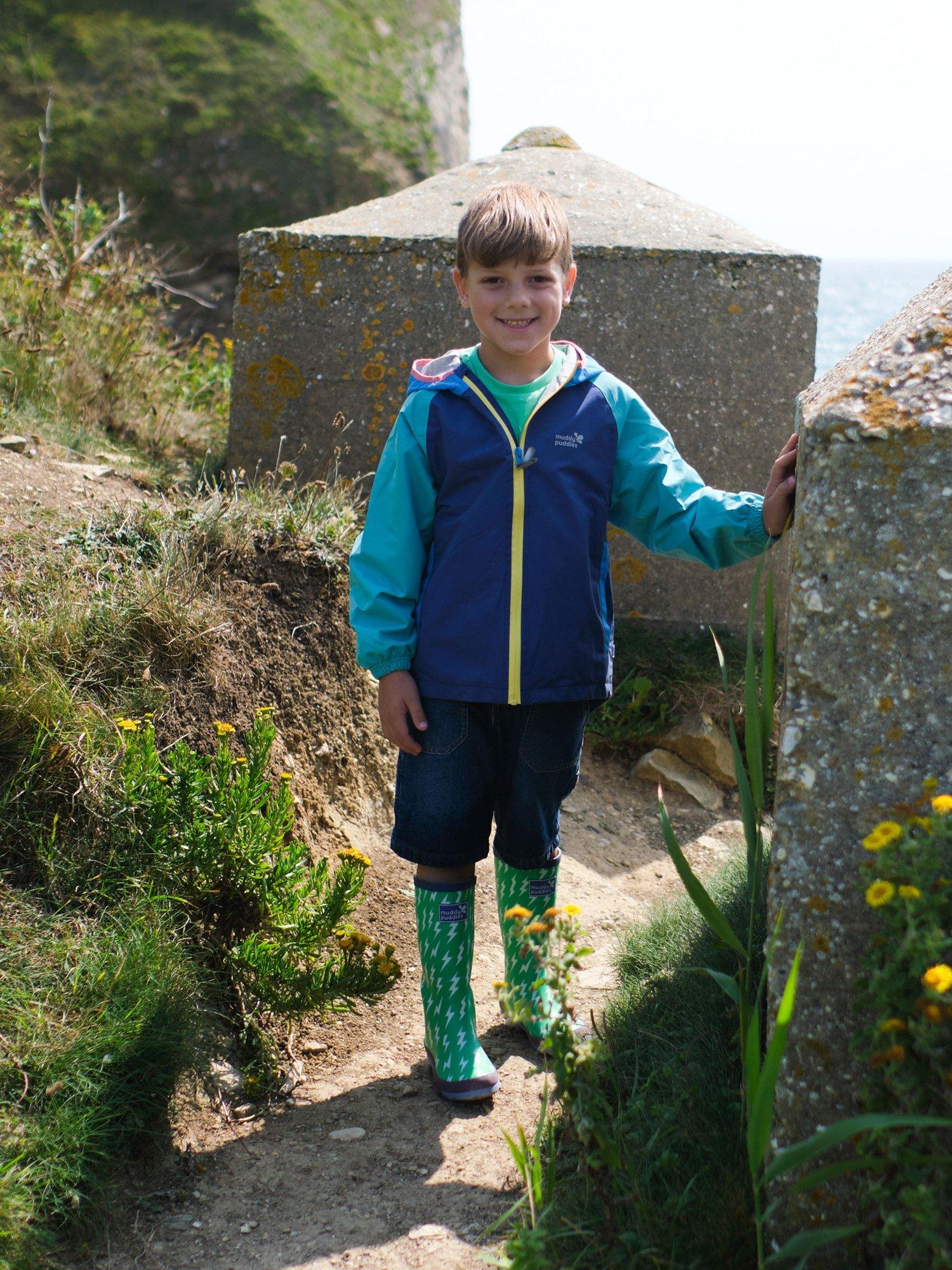 Product image 3 of 6, which shows Muddy Puddles Kids' EcoLight Waterproof Lightweight Colour Block Jacket, Blue/Green, 12-18 months
