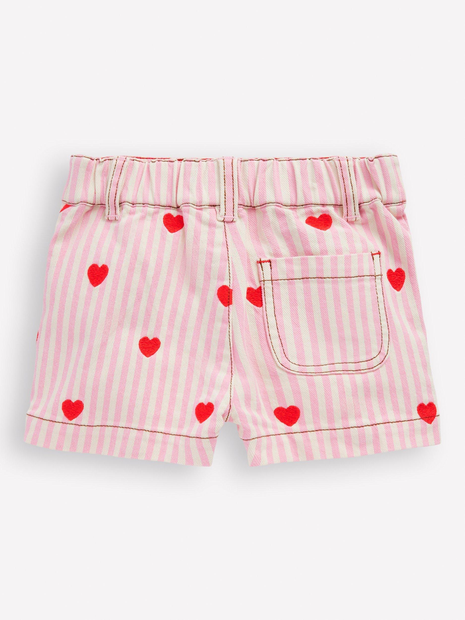 Product image 2 of 3, which shows Mini Boden Girl's Patch Pocket Shorts, Pink/Ivory Hearts, 2-3 years