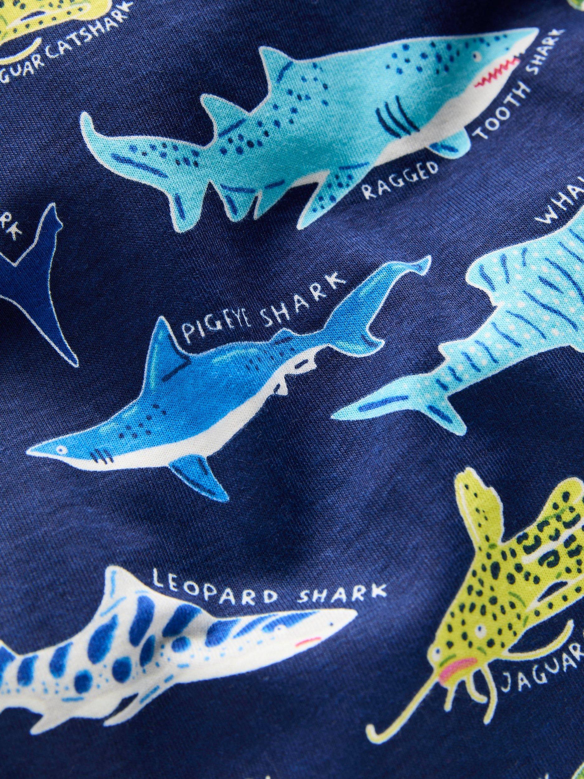 Product image 3 of 3, which shows Mini Boden Kids' Cotton Glow-in-th-Dark Short John Pyjamas, College Navy Sharks, 2 years