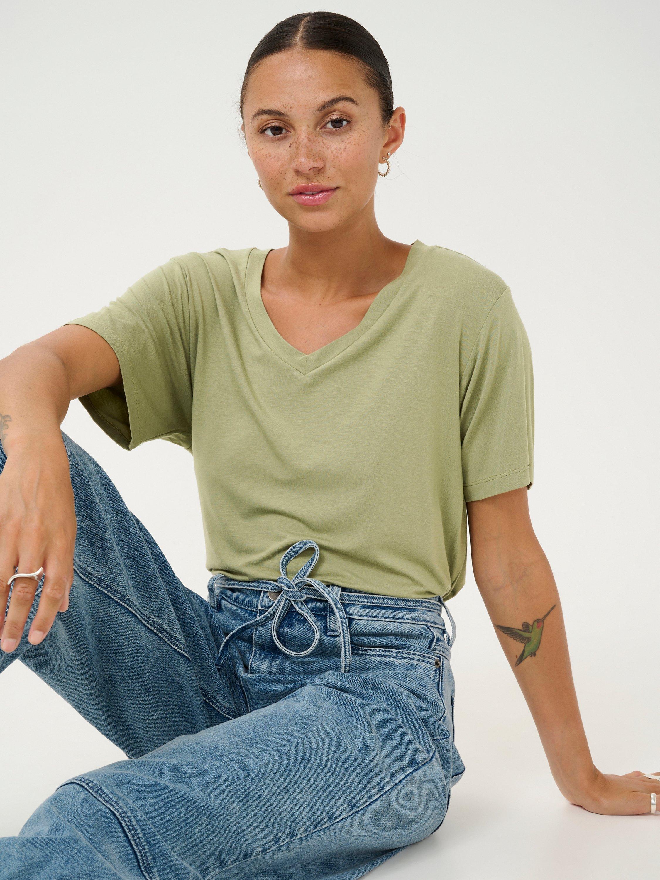 Product image 4 of 6, which shows KAFFE Frida V-Neck T-Shirt, Oil Green, XS