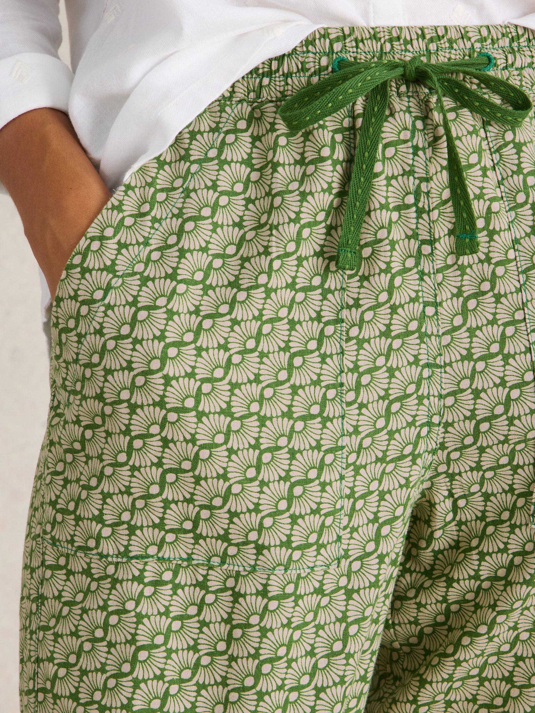 Product image 3 of 6, which shows White Stuff Elle Graphic Floral Linen Blend Trousers, Green/Cream, 10R