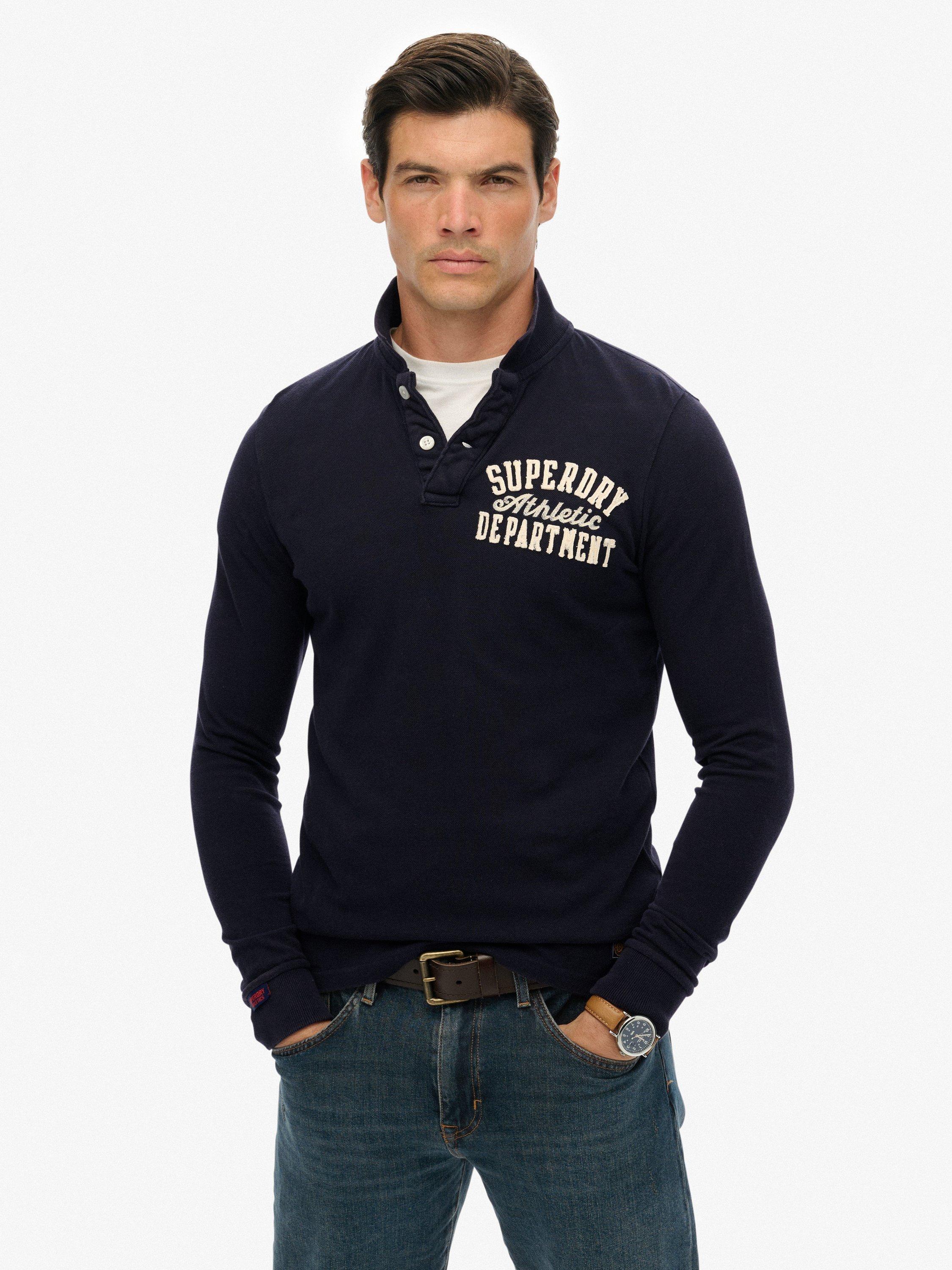 Product image 1 of 7, which shows Superdry Vintage Athletic Long Sleeve Cotton Polo Shirt, Eclipse Navy, S