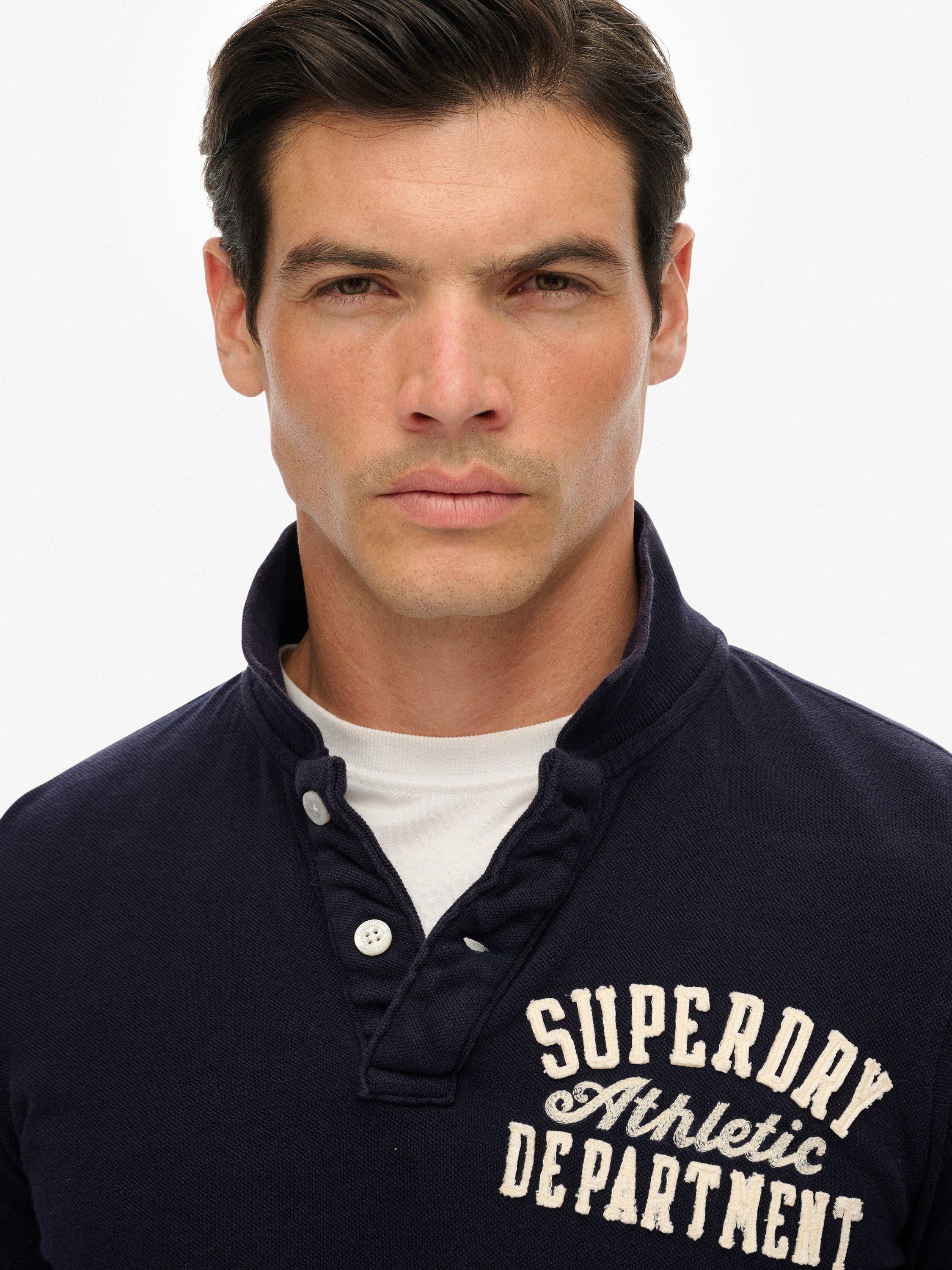 Product image 5 of 7, which shows Superdry Vintage Athletic Long Sleeve Cotton Polo Shirt, Eclipse Navy, S