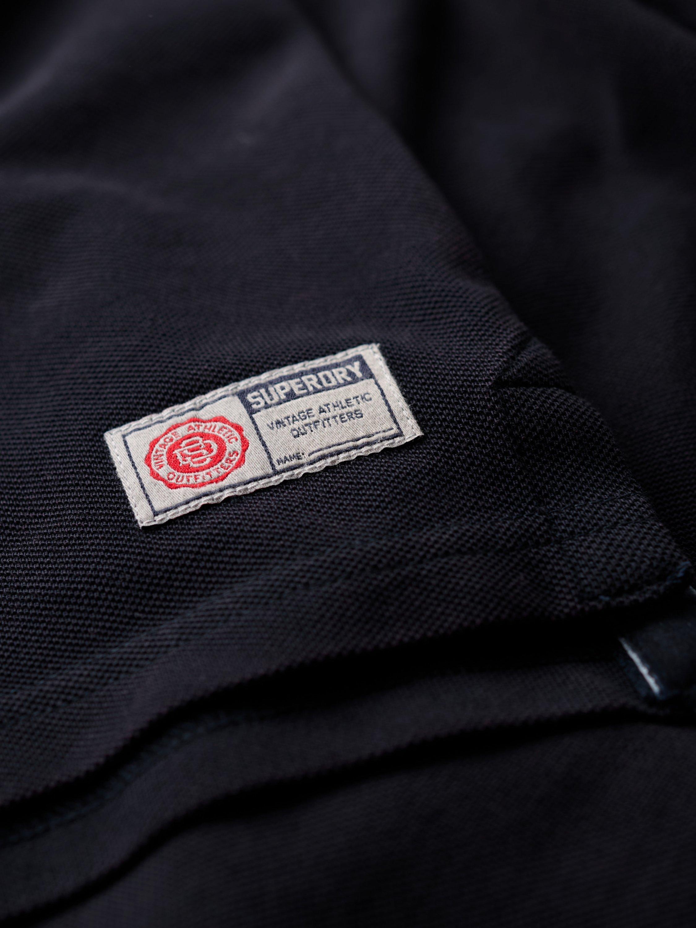 Product image 7 of 7, which shows Superdry Vintage Athletic Long Sleeve Cotton Polo Shirt, Eclipse Navy, S