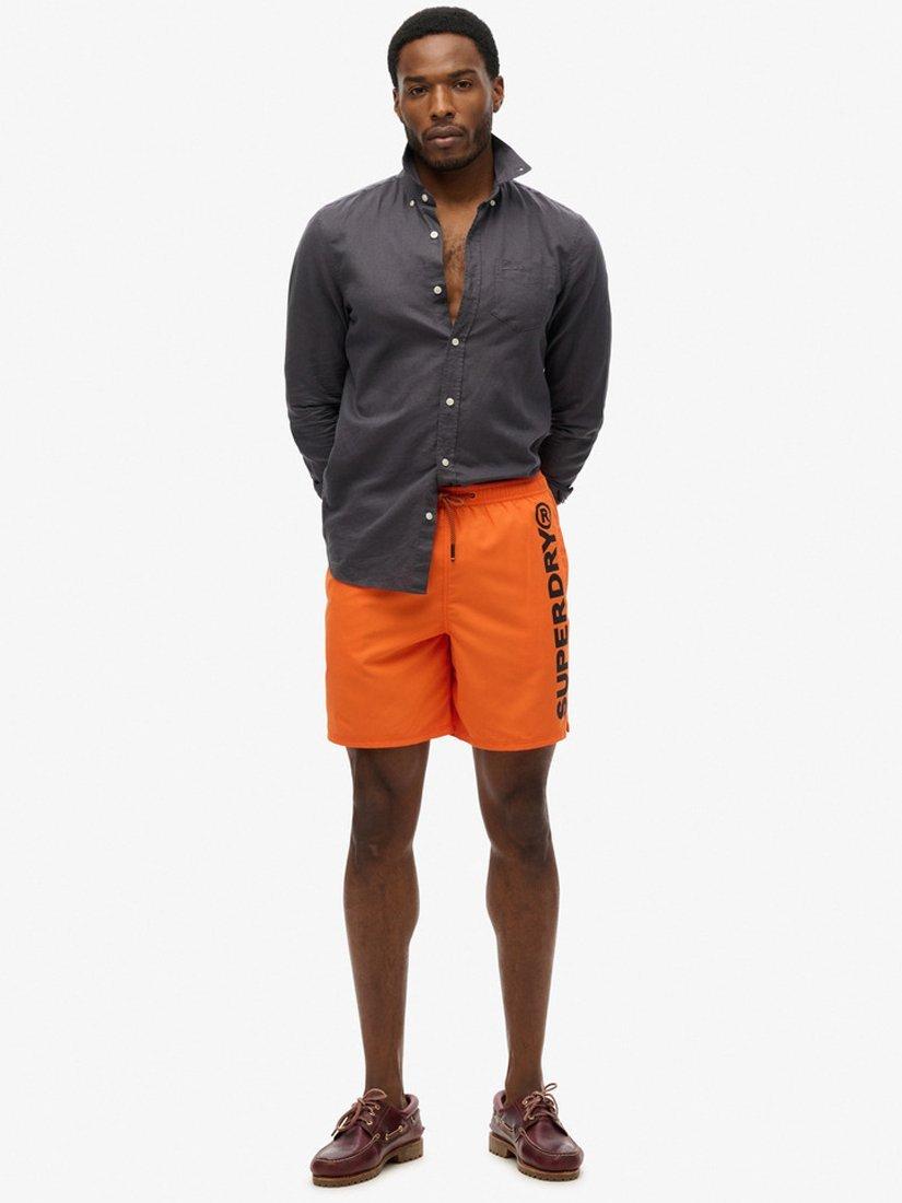 Product image 1 of 7, which shows Superdry Sport Graphic 17" Swim Shorts, Denver Orange, S