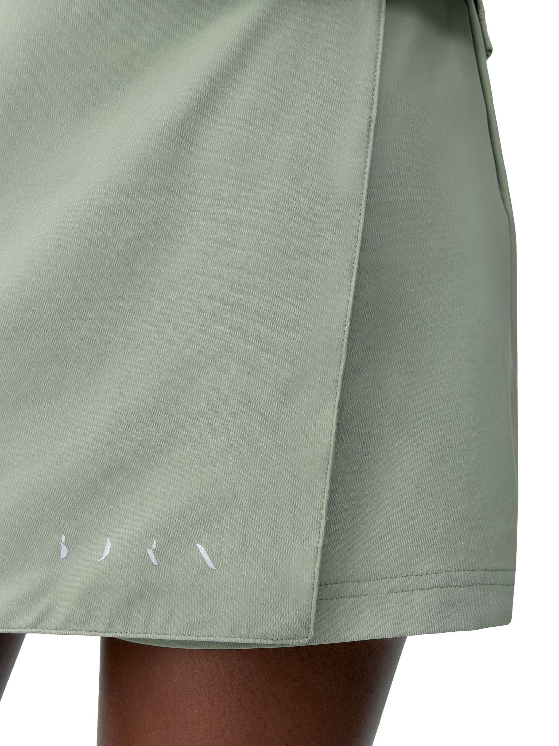 Product image 4 of 6, which shows Born Living Yoga Sports Skirt with Inner Shorts, Green, XS