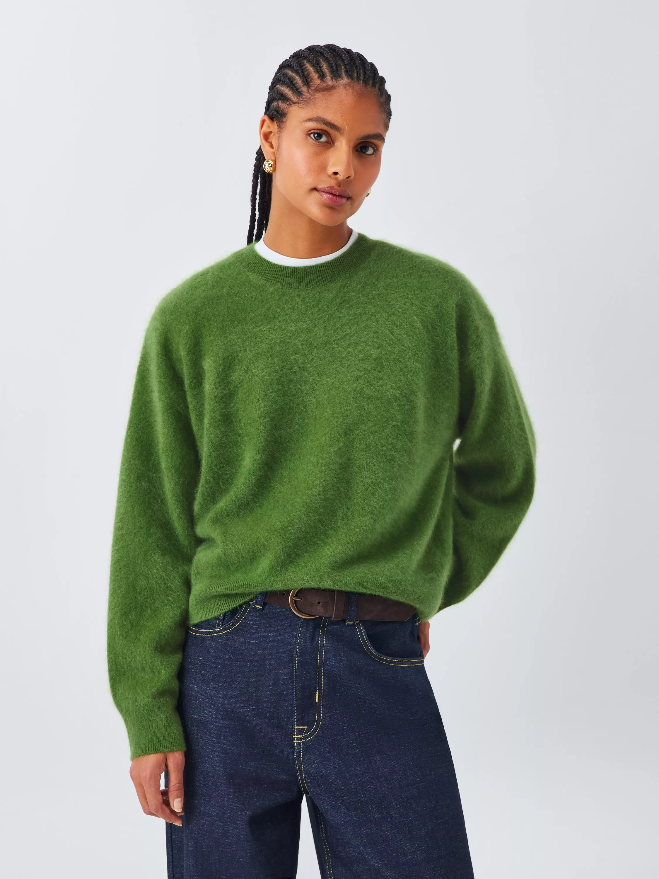 woman wearing green knit jumper