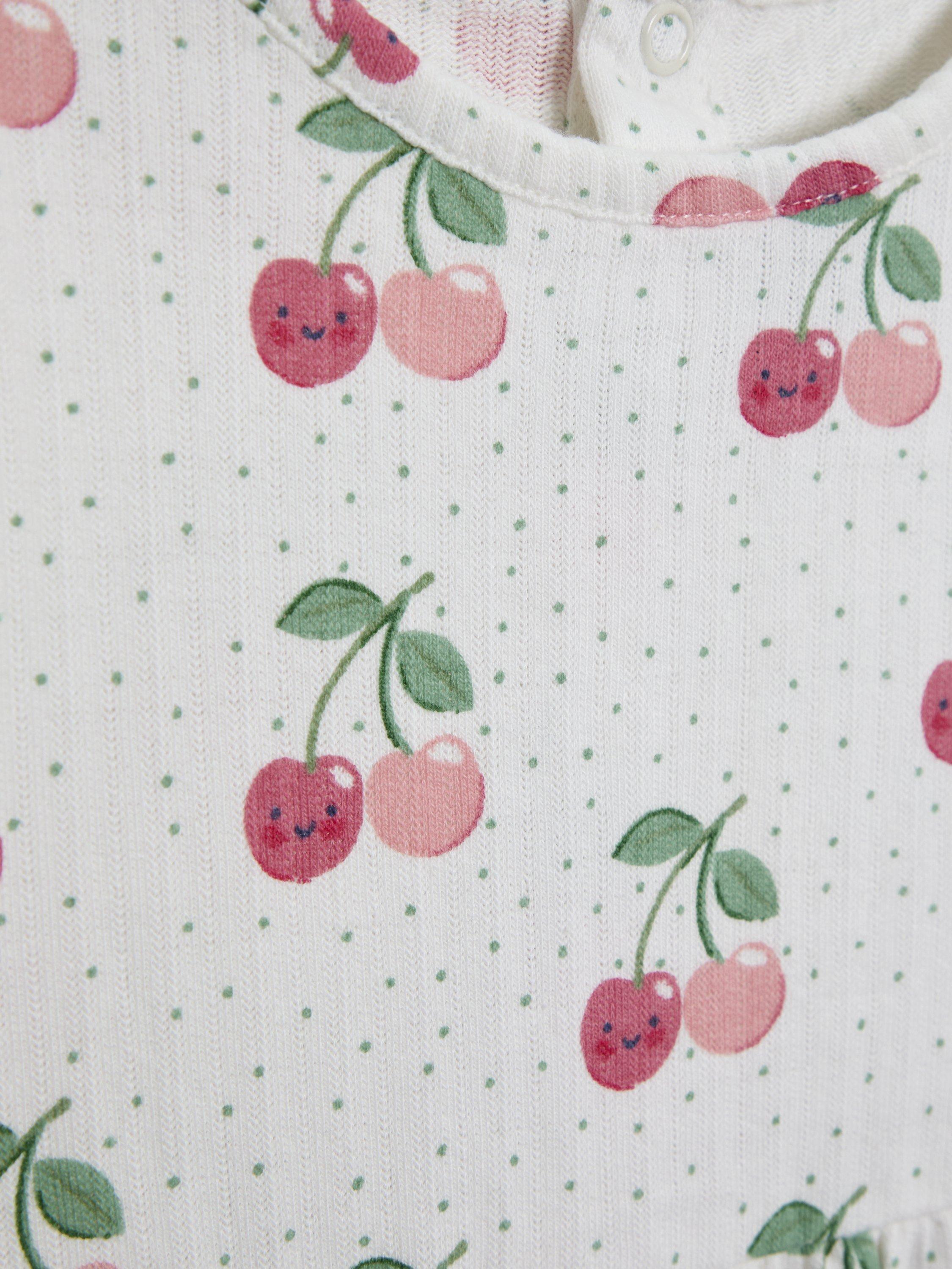 Product image 4 of 7, which shows JoJo Maman Bébé Kids' Cotton Plain & Cherry Print Tunic Tops, Pack of 2, Cream, 6-12 months