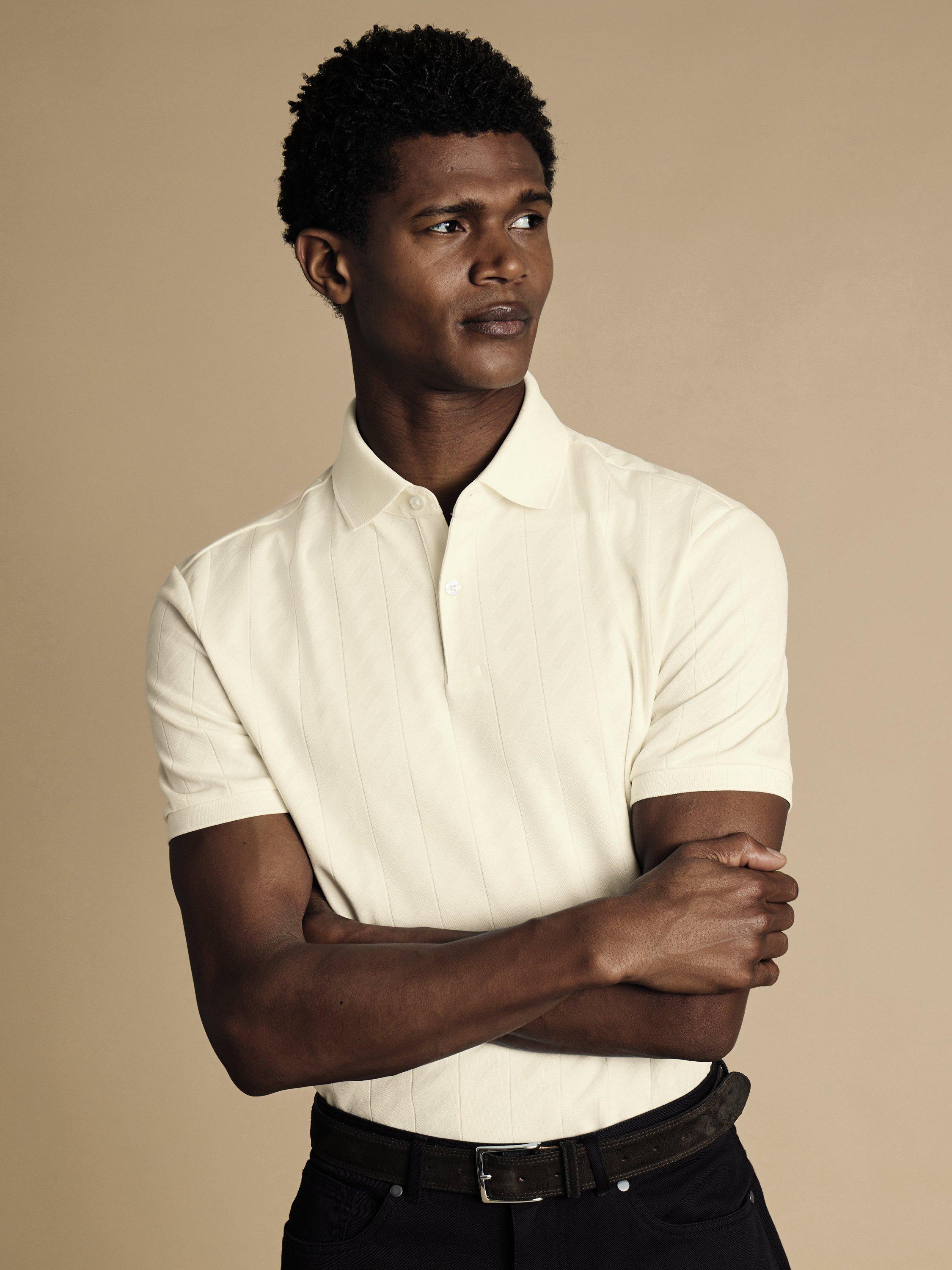 Product image 1 of 5, which shows Charles Tyrwhitt Short Sleeve Cotton Blend Polo Shirt, Cream, S