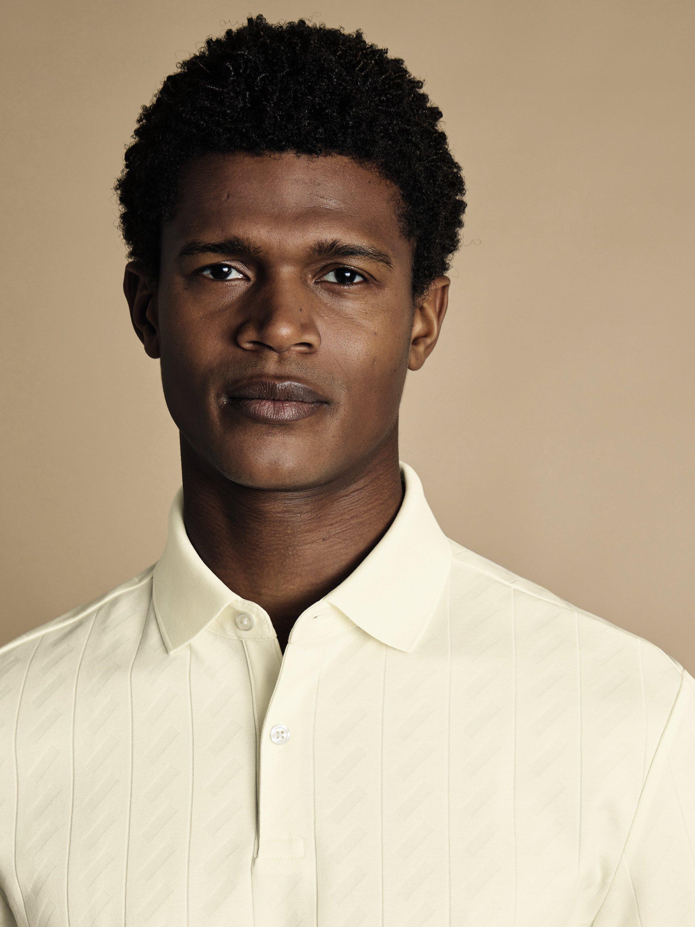 Product image 2 of 5, which shows Charles Tyrwhitt Short Sleeve Cotton Blend Polo Shirt, Cream, S