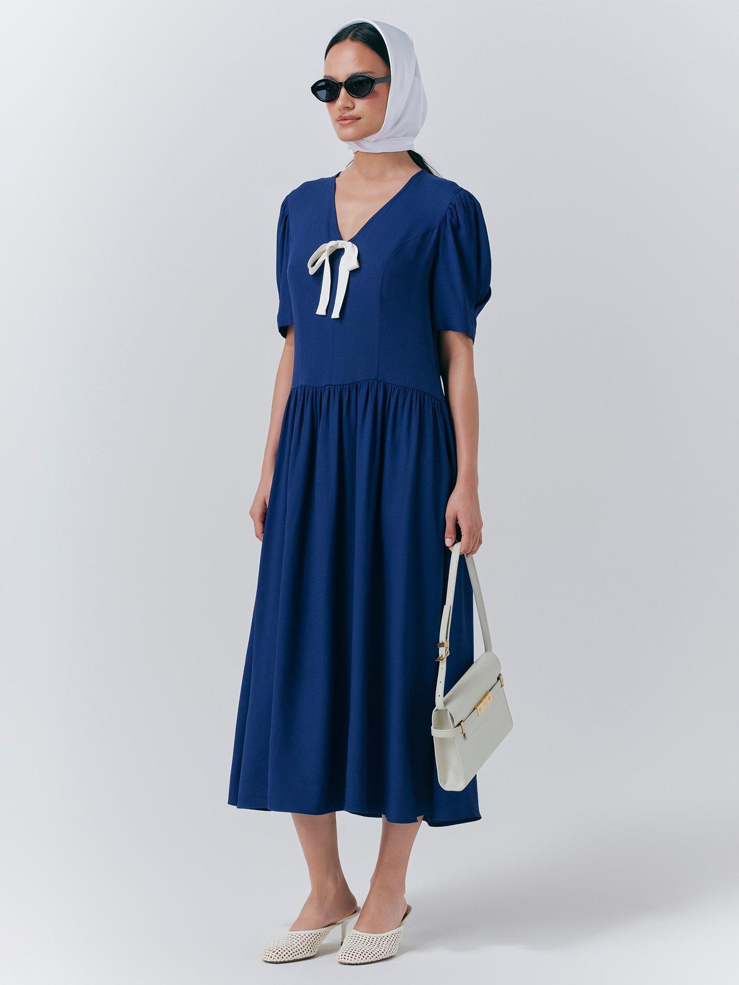 Product image 2 of 5, which shows Ghost Peoni Bow Detail Midi Dress, Dark Blue, XS