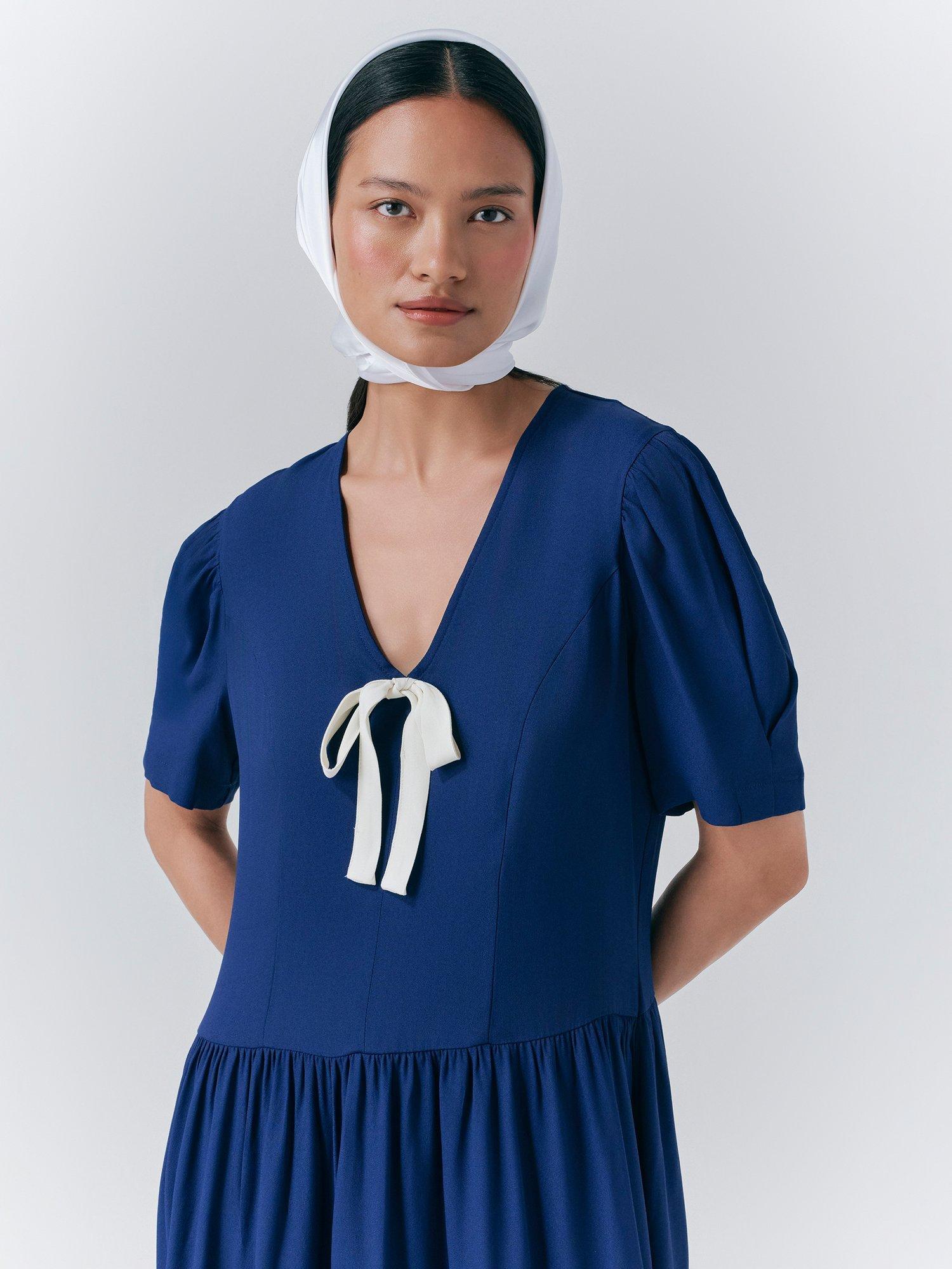 Product image 4 of 5, which shows Ghost Peoni Bow Detail Midi Dress, Dark Blue, XS