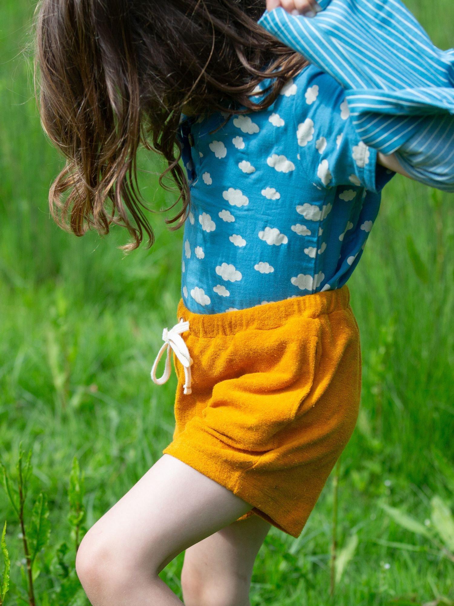 Product image 5 of 5, which shows Little Green Radicals Kids' Pure Organic Cotton Towelling Shorts, Gold, 2-3 years