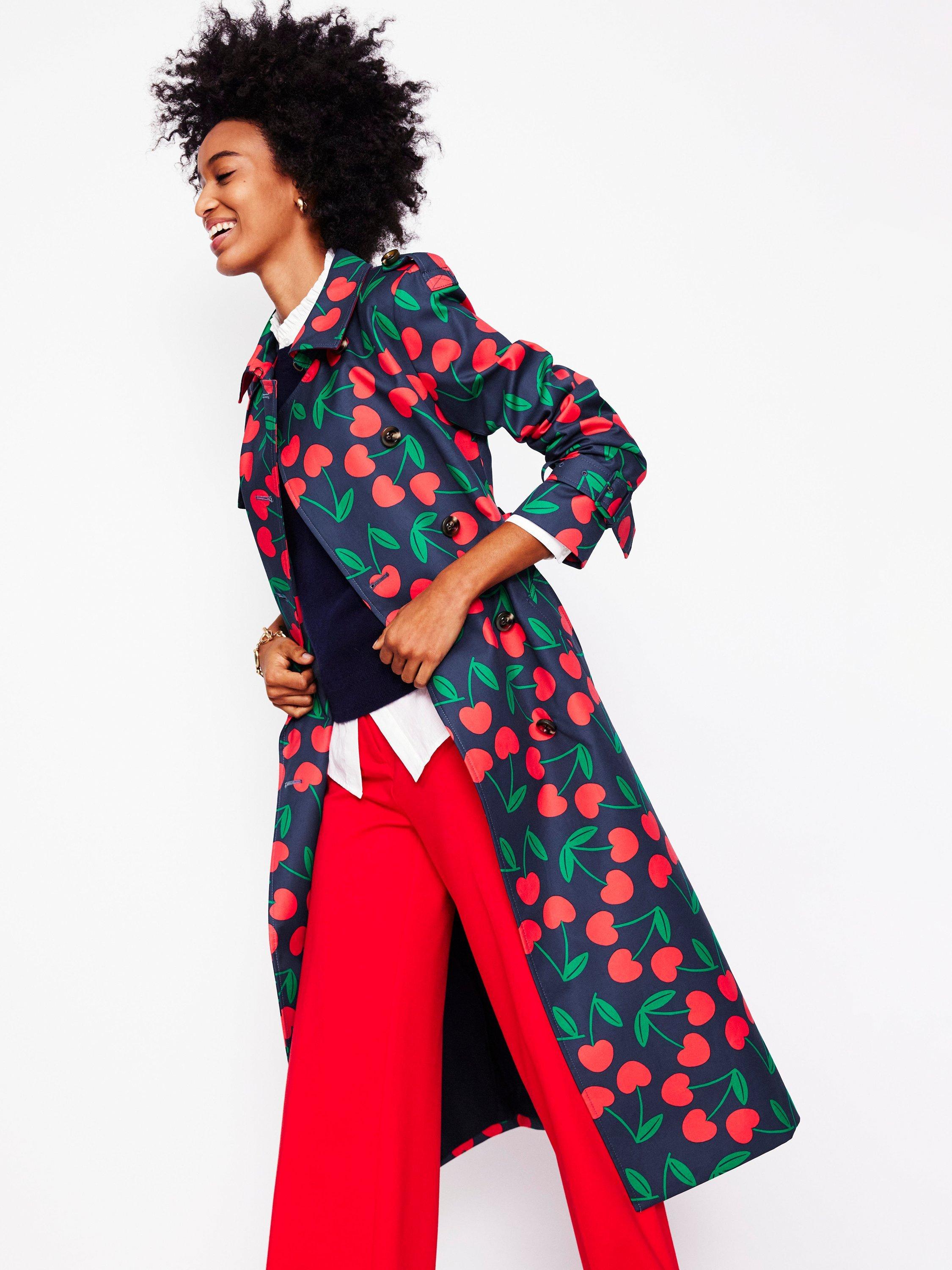 Product image 1 of 5, which shows Boden Cheltenham Cherry Print Trench Coat, Navy/Multi, 8