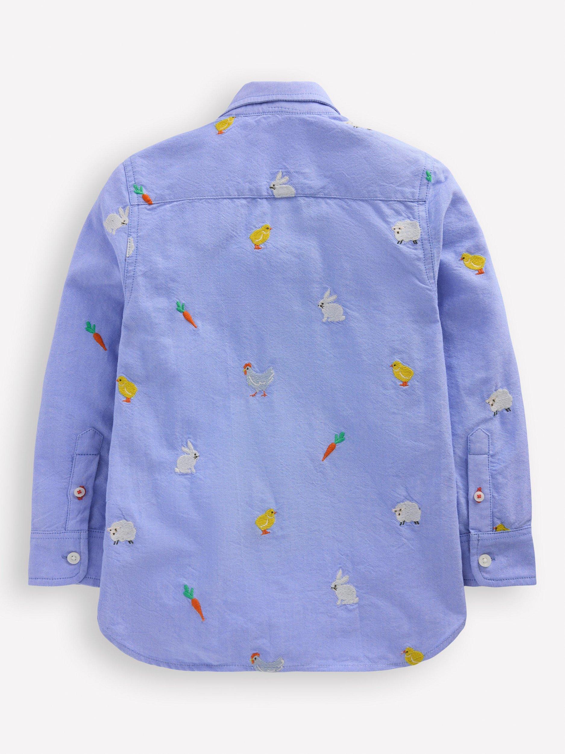 Product image 2 of 3, which shows Mini Boden Kids' Cotton Spring Embroidered Shirt, Blue/Multi, 7-8 years