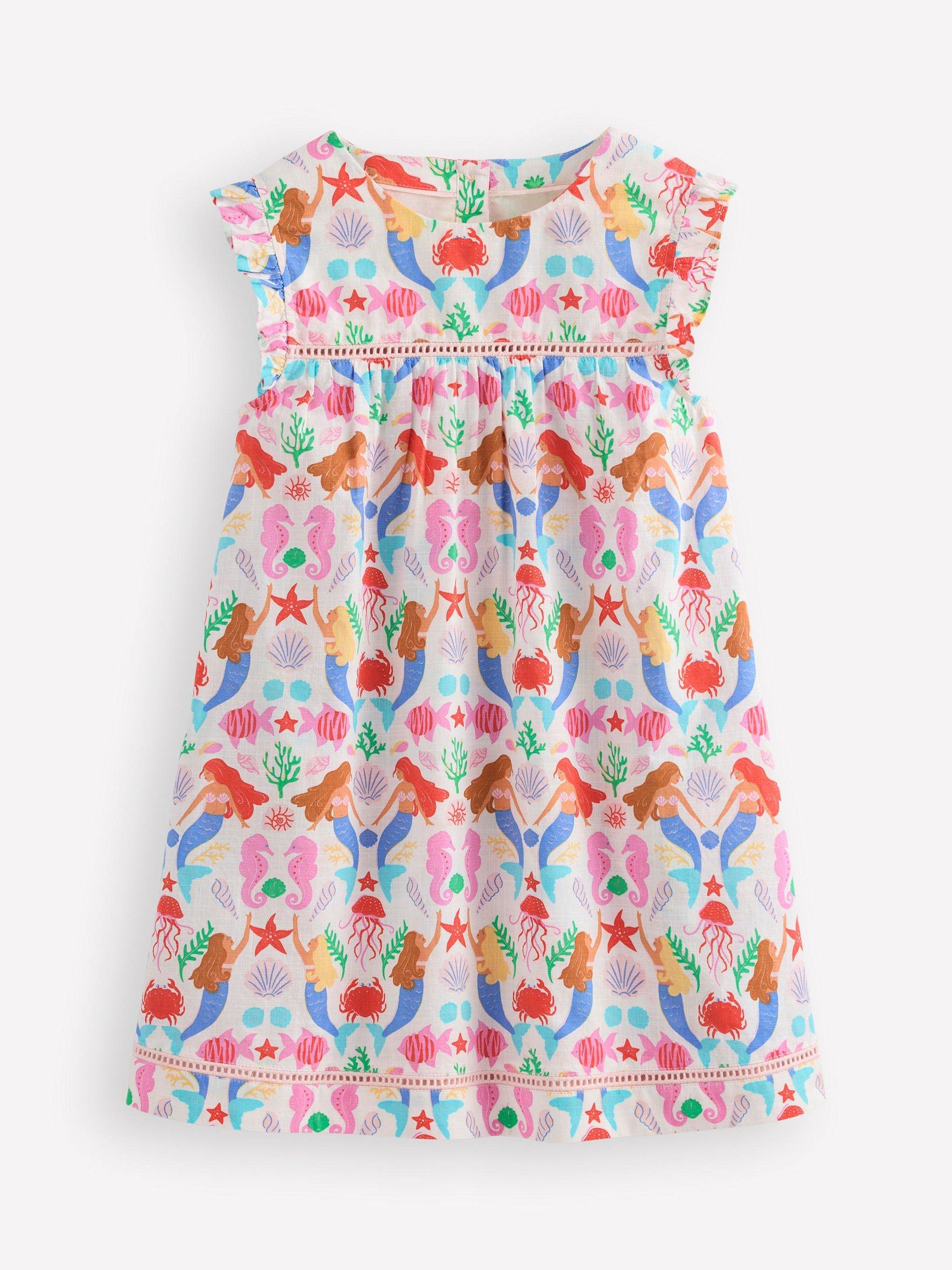 Product image 1 of 3, which shows Mini Boden Kids' Celia Woven Cotton Holiday Dress, Ivory Mermaids, 11-12 years