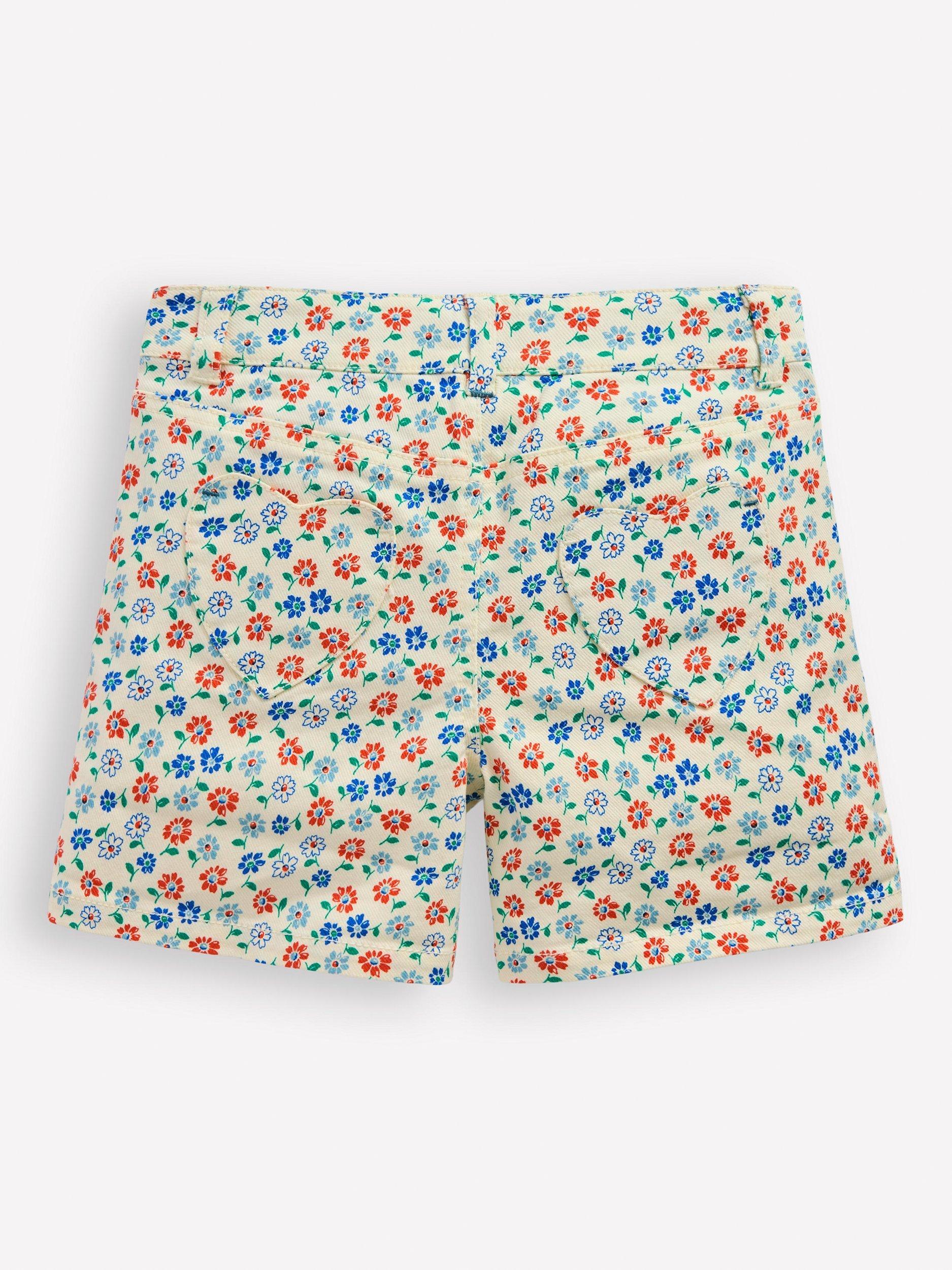 Product image 2 of 3, which shows Mini Boden Kids' Denim Shorts, White Vintage Daisy, 4-5 years