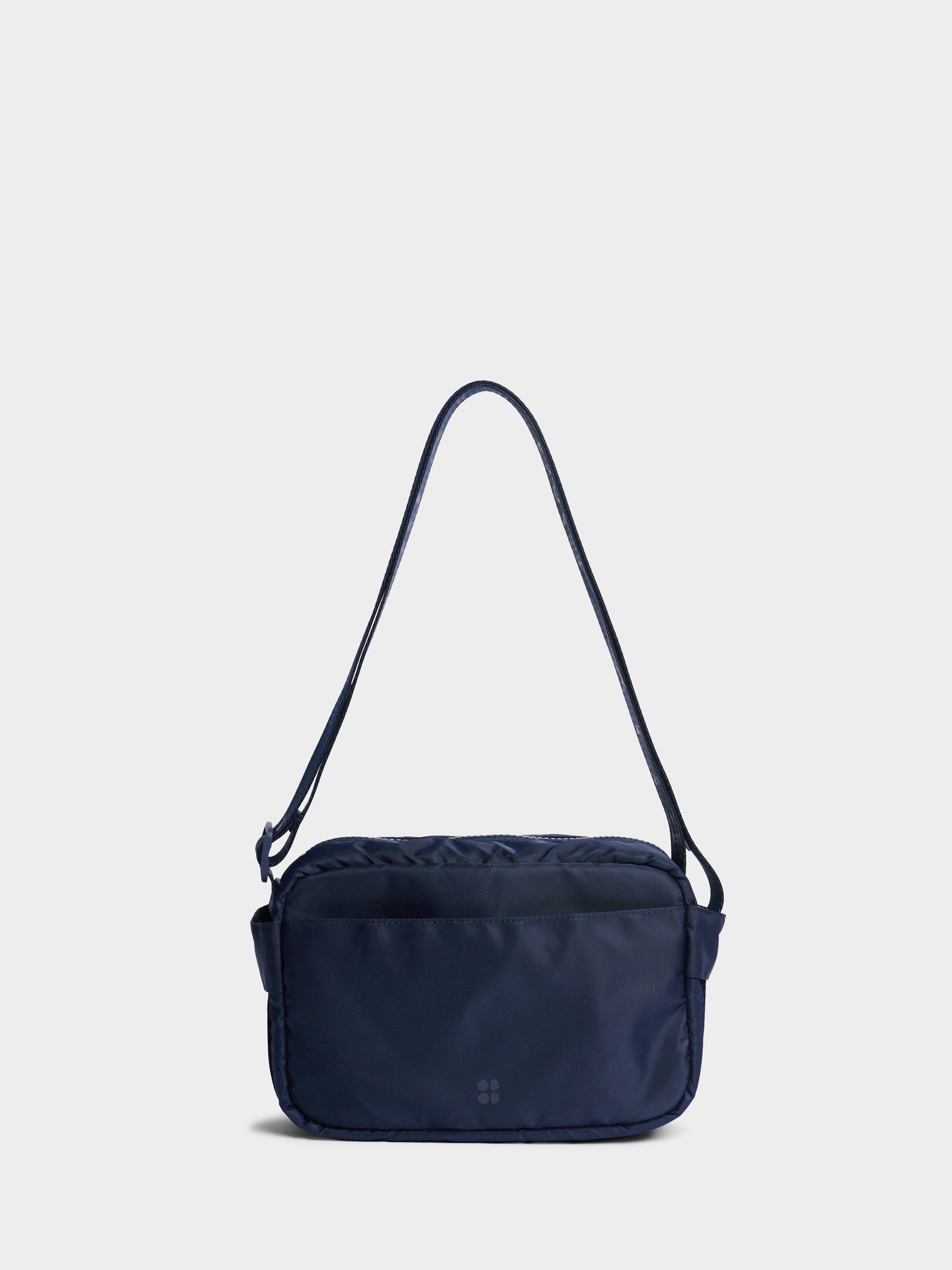 Product image 1 of 5, which shows Sweaty Betty Motion Travel Crossbody Bag, Navy Blue