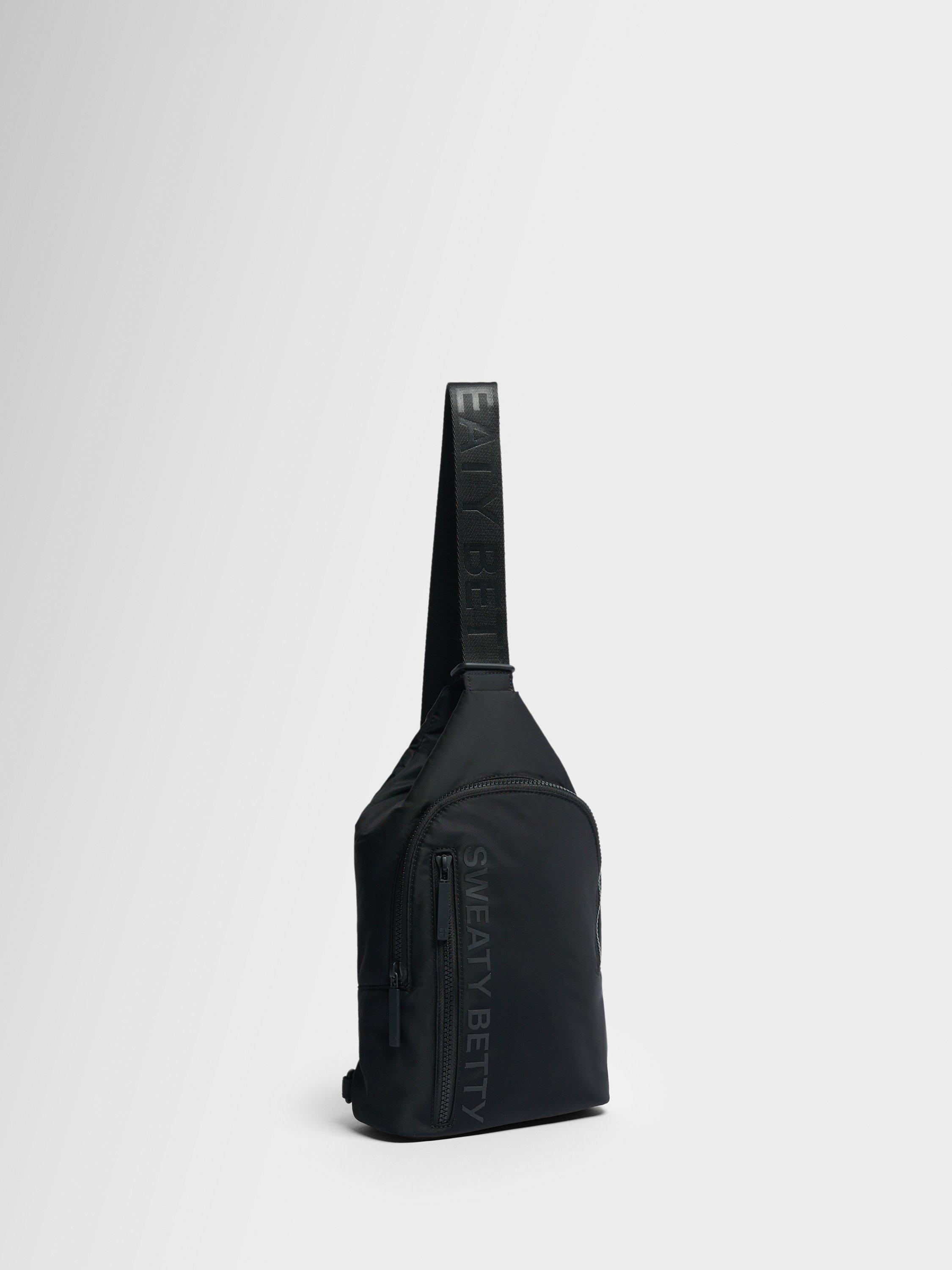 Product image 2 of 5, which shows Sweaty Betty Motion Sling Bag, Black
