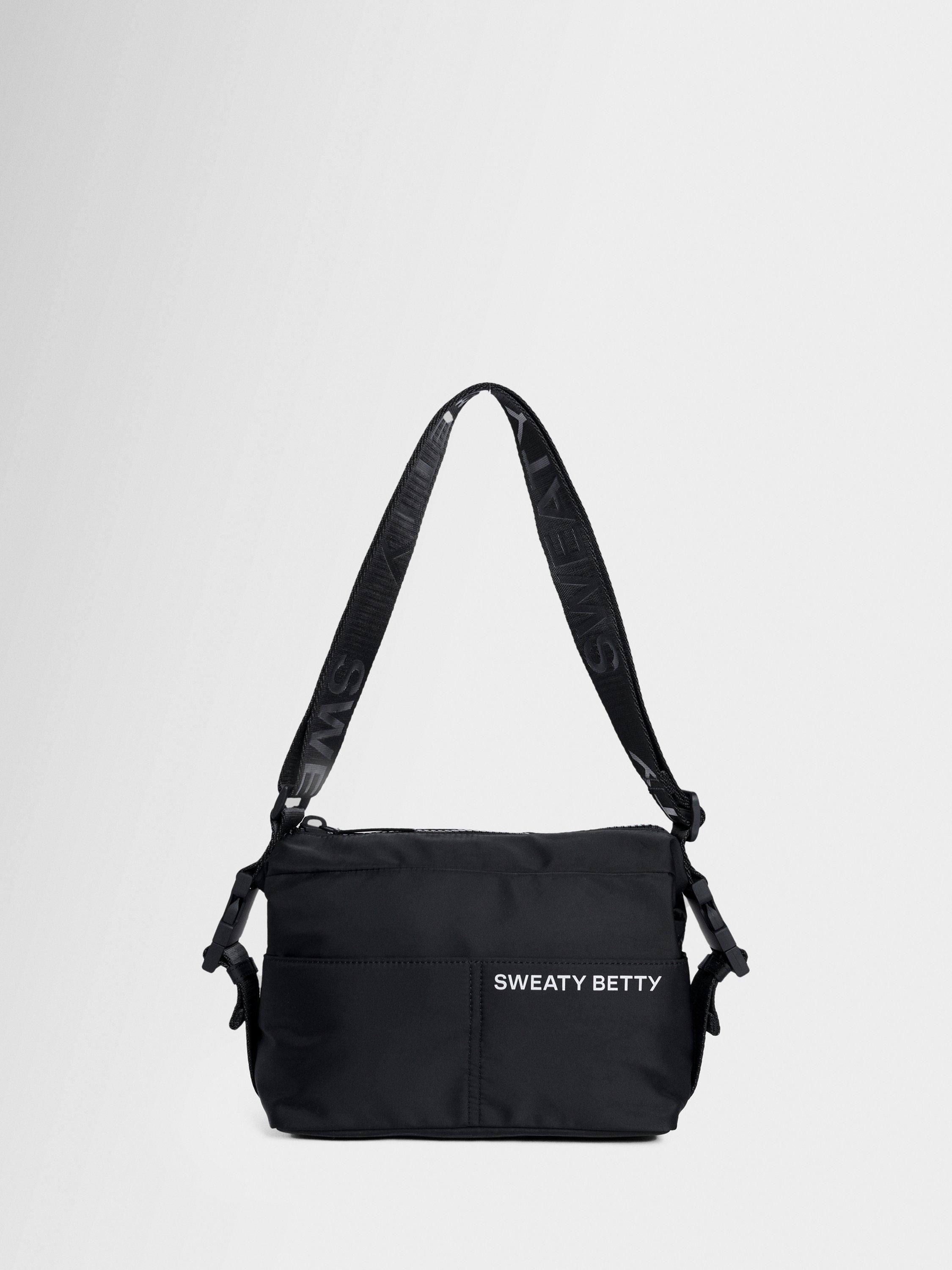 Product image 1 of 6, which shows Sweaty Betty Strive Crossbody Bag, Black