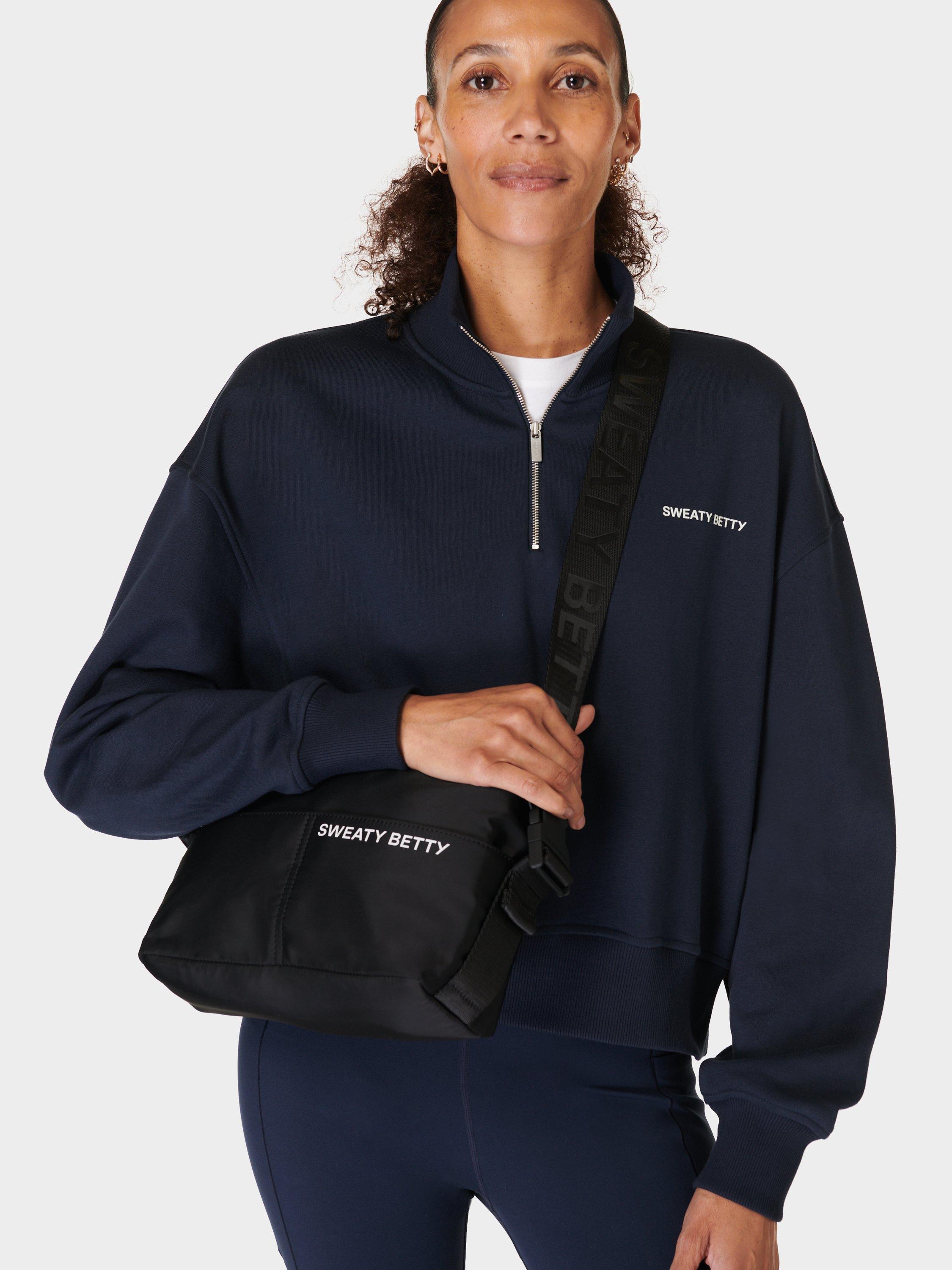 Product image 2 of 6, which shows Sweaty Betty Strive Crossbody Bag, Black