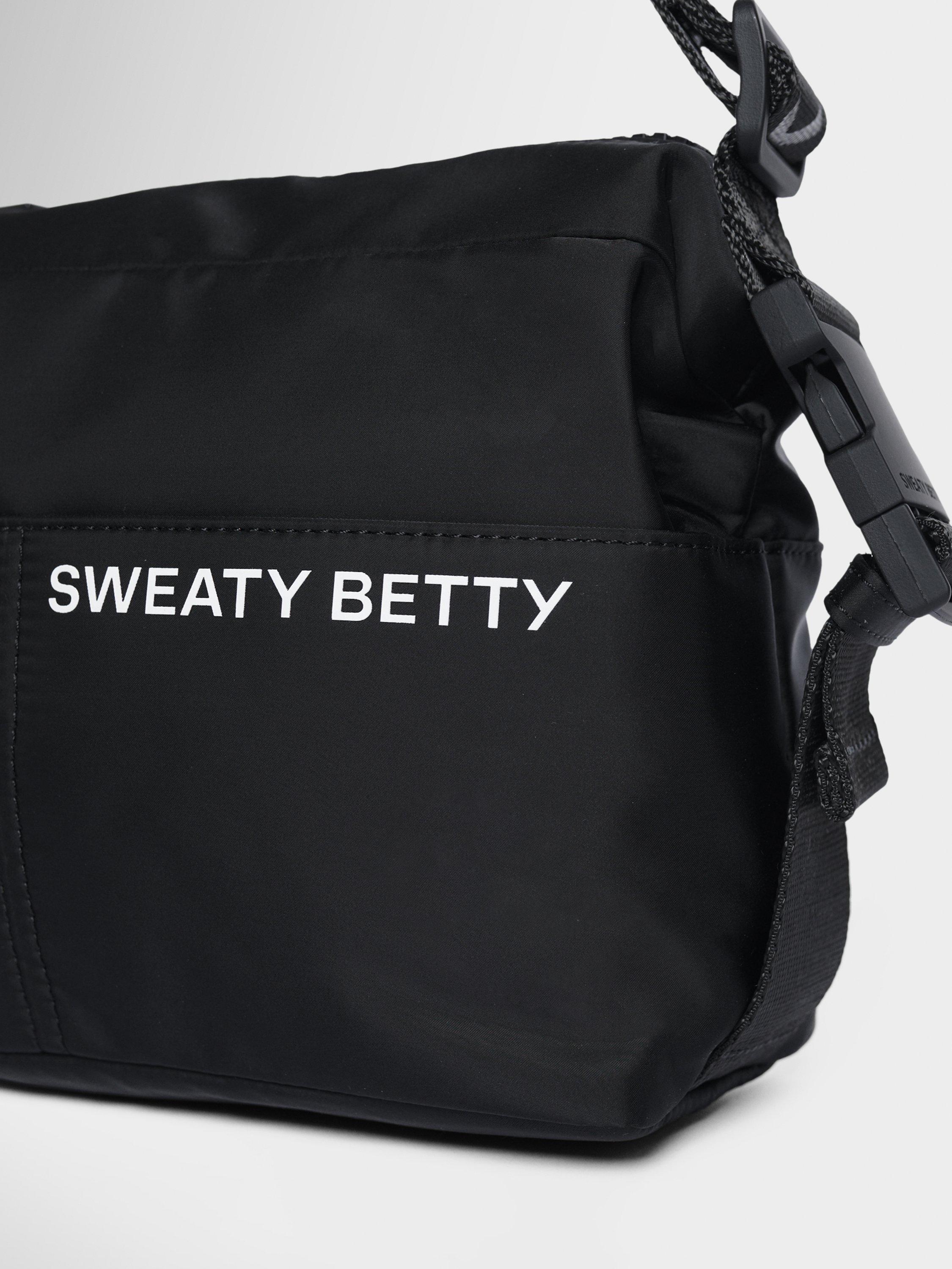 Product image 4 of 6, which shows Sweaty Betty Strive Crossbody Bag, Black