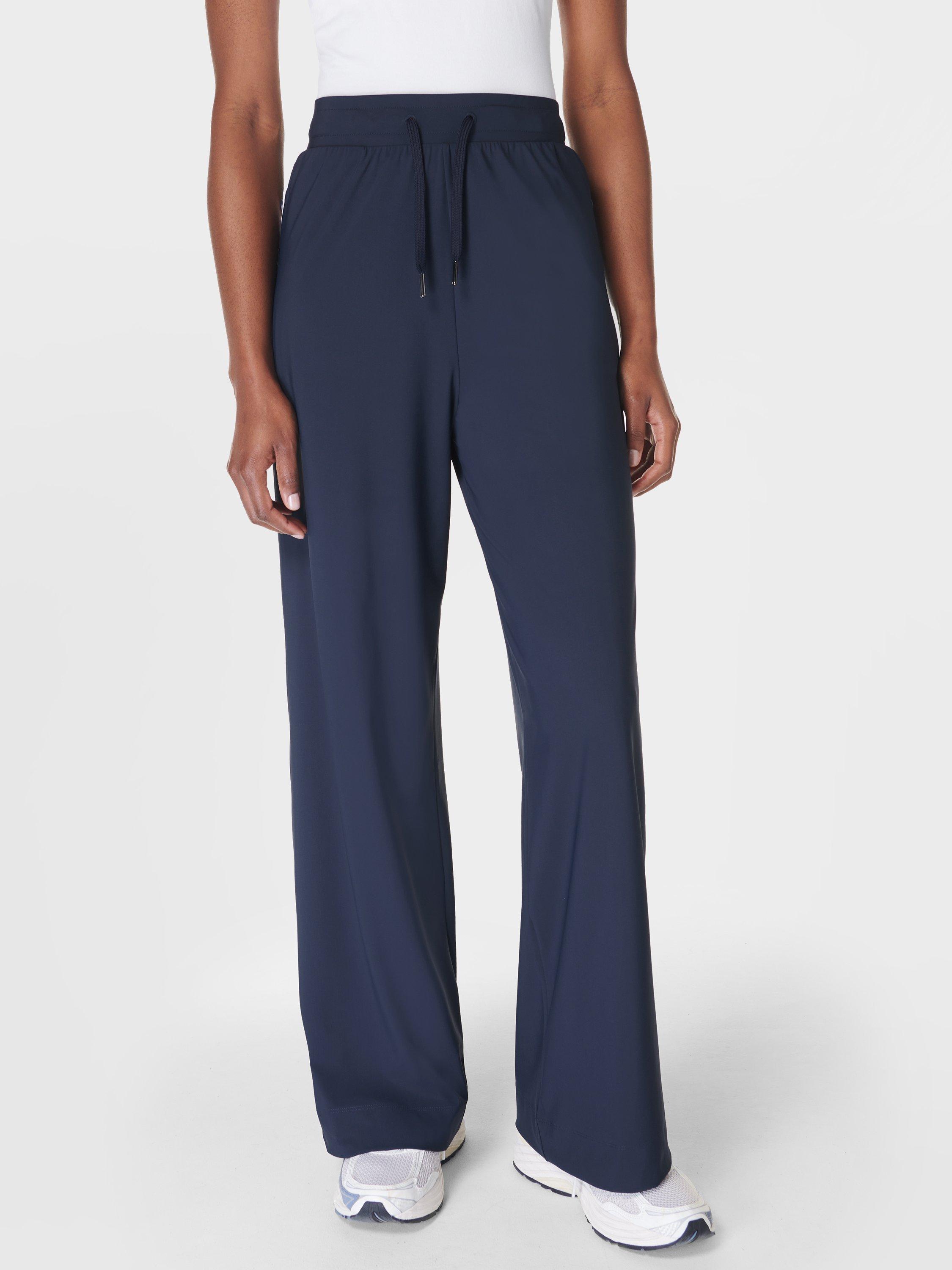 Product image 1 of 7, which shows Sweaty Betty Explorer 32" Wide Leg Trousers, Navy Blue, XXS
