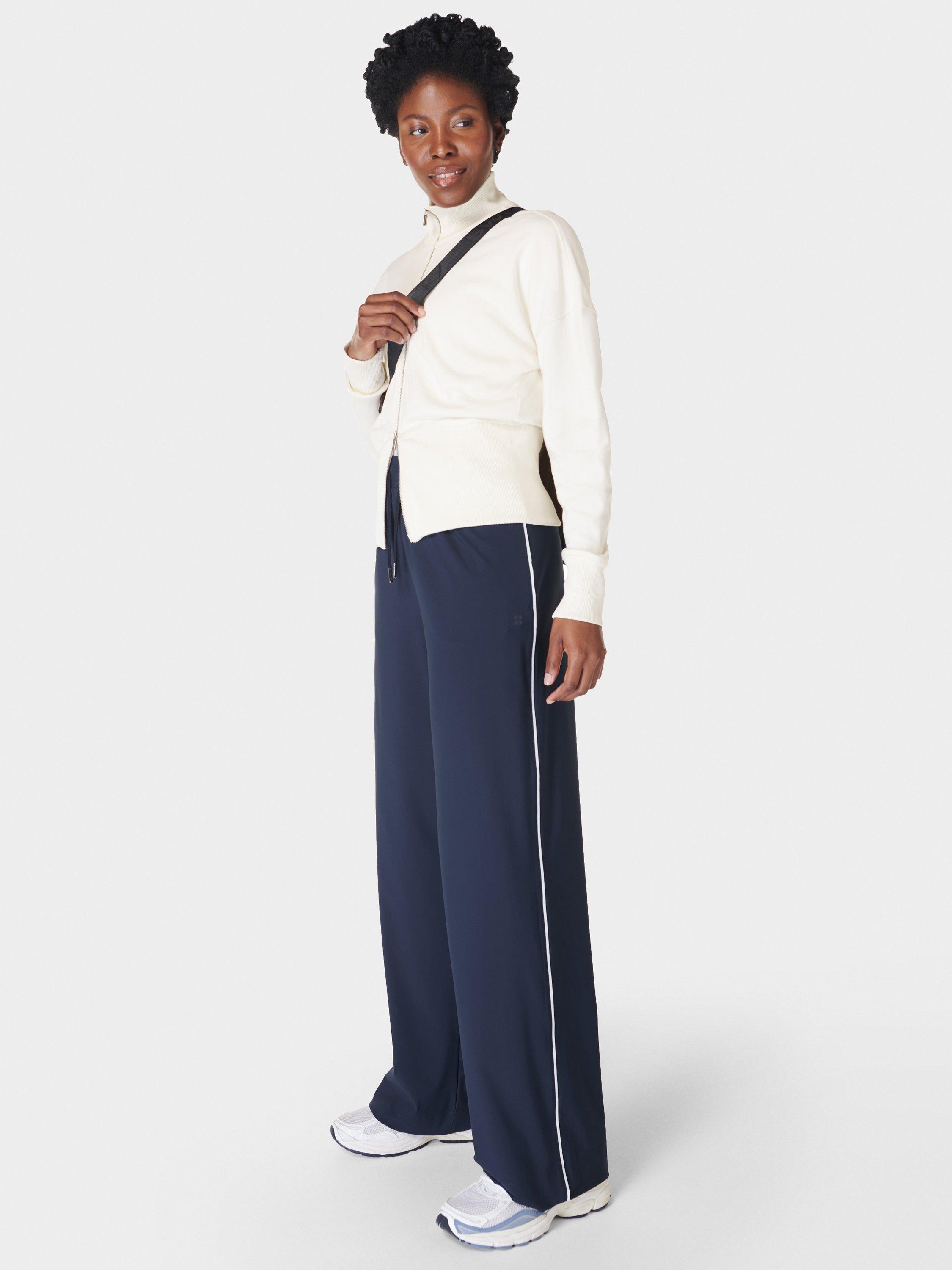 Product image 2 of 7, which shows Sweaty Betty Explorer 32" Wide Leg Trousers, Navy Blue, XXS