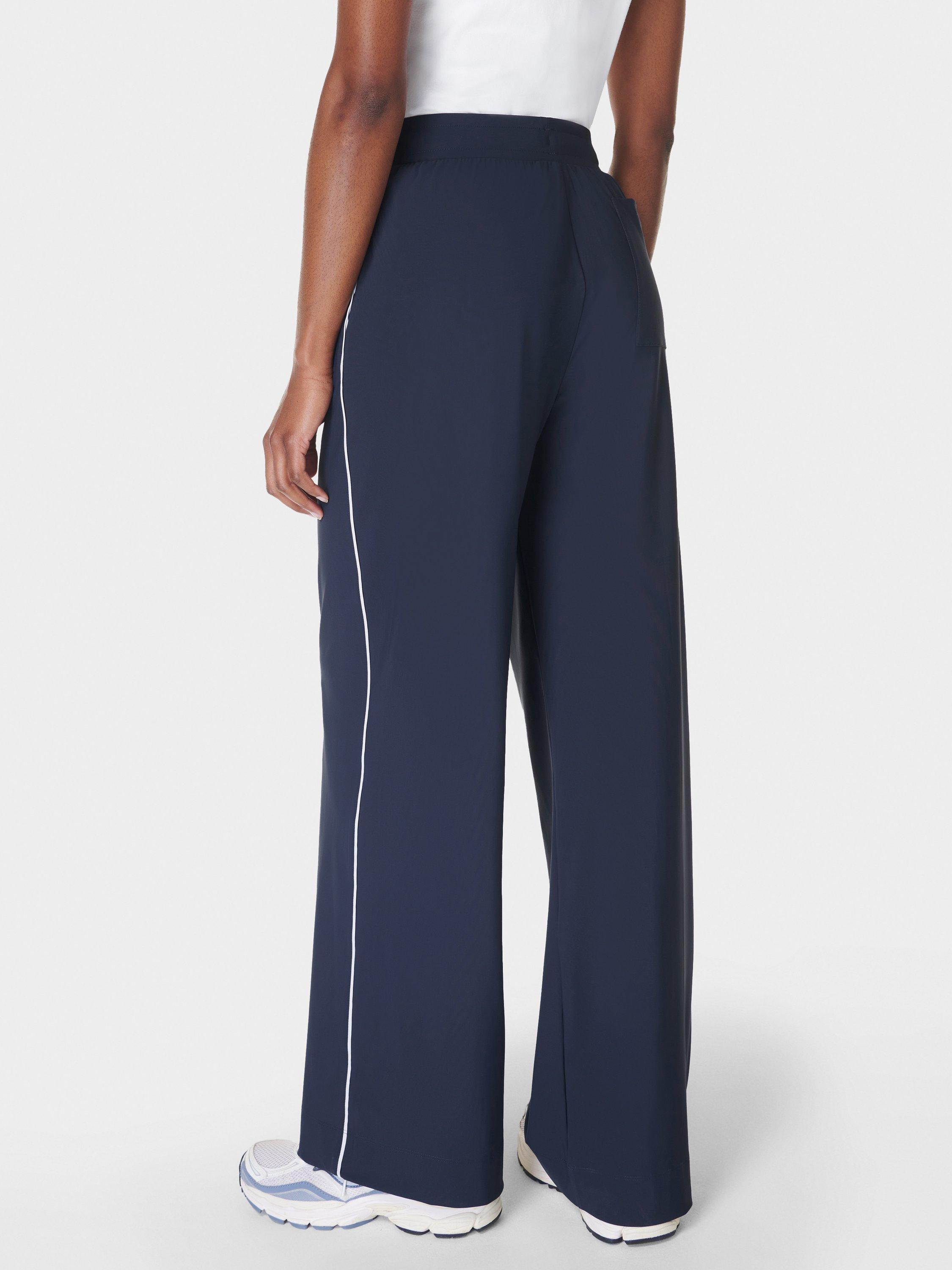 Product image 3 of 7, which shows Sweaty Betty Explorer 32" Wide Leg Trousers, Navy Blue, XXS