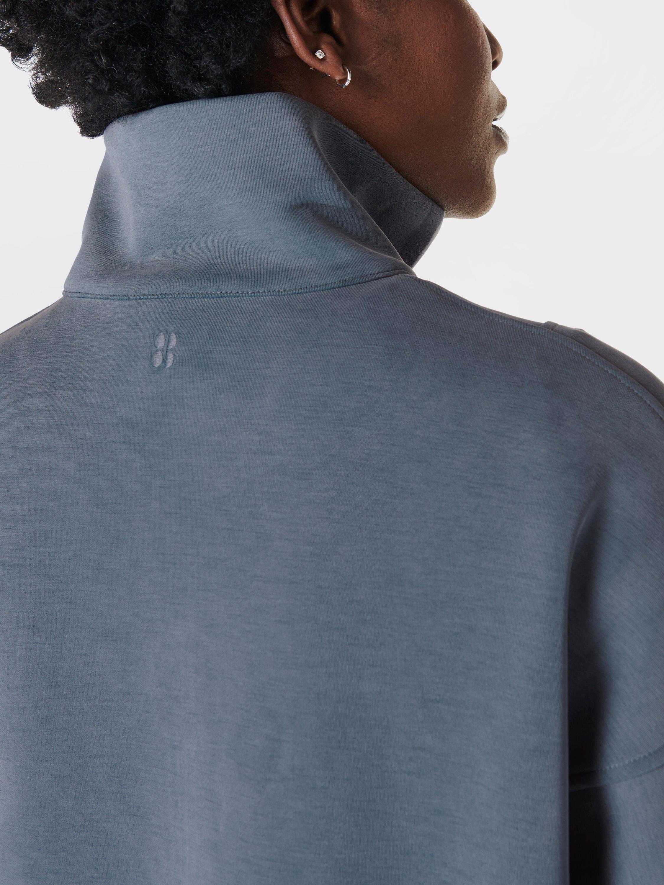 Product image 2 of 6, which shows Sweaty Betty Sand Wash Funnel Neck Half Zip Sweatshirt, Subdued Blue, XXS
