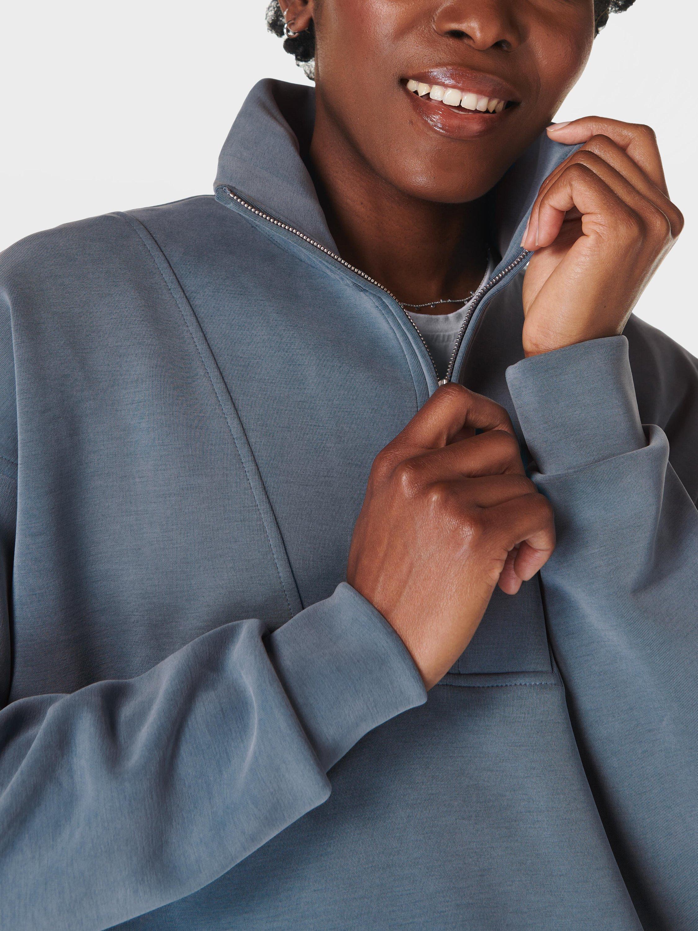Product image 5 of 6, which shows Sweaty Betty Sand Wash Funnel Neck Half Zip Sweatshirt, Subdued Blue, XXS