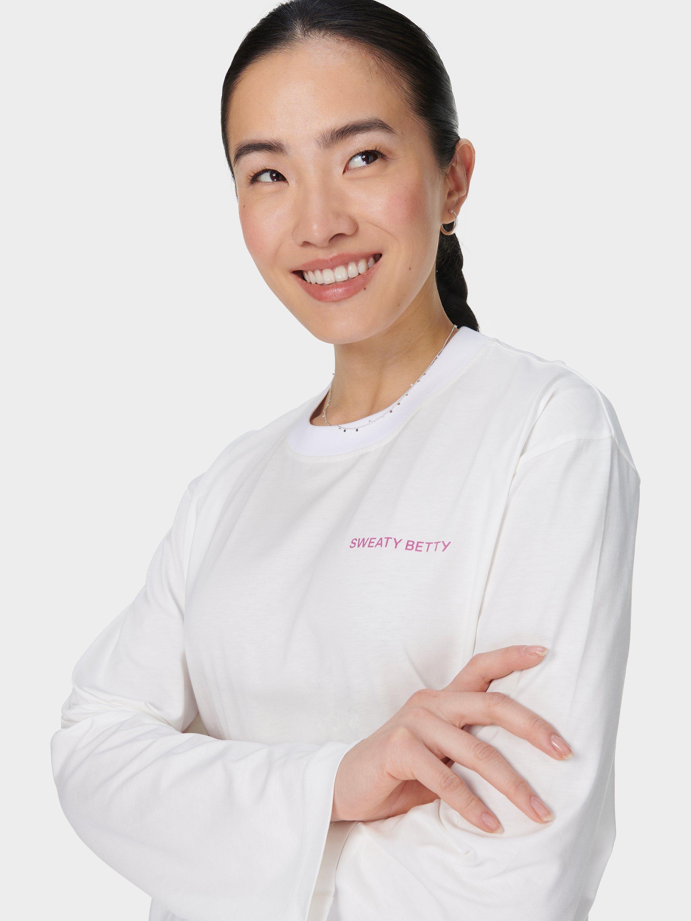 Product image 5 of 7, which shows Sweaty Betty Logo Pure Organic Cotton Long Sleeve Top, Lily White, XXS