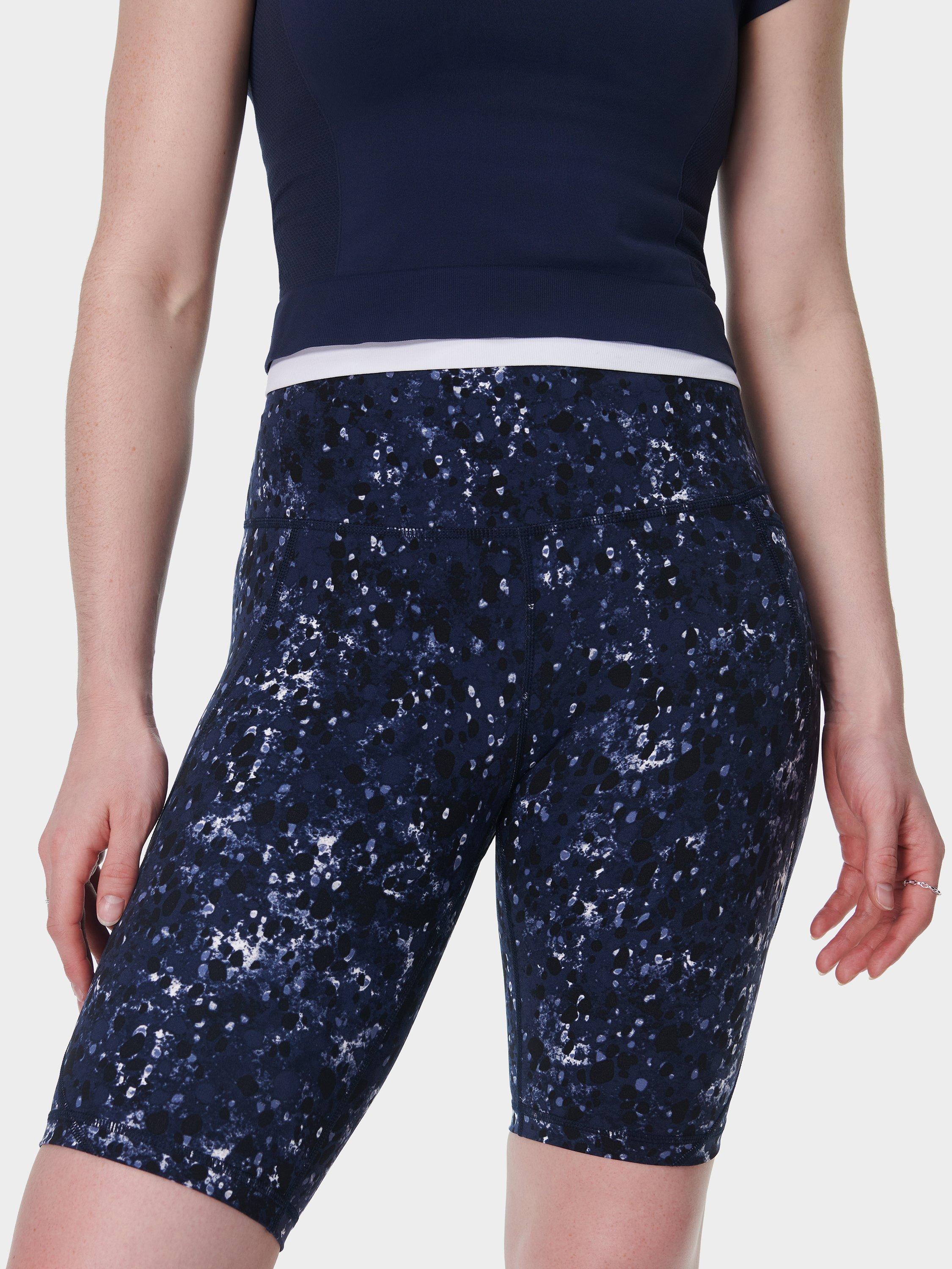 Product image 1 of 9, which shows Sweaty Betty Power 9" Biker Shorts, Blue/Multi, XXS