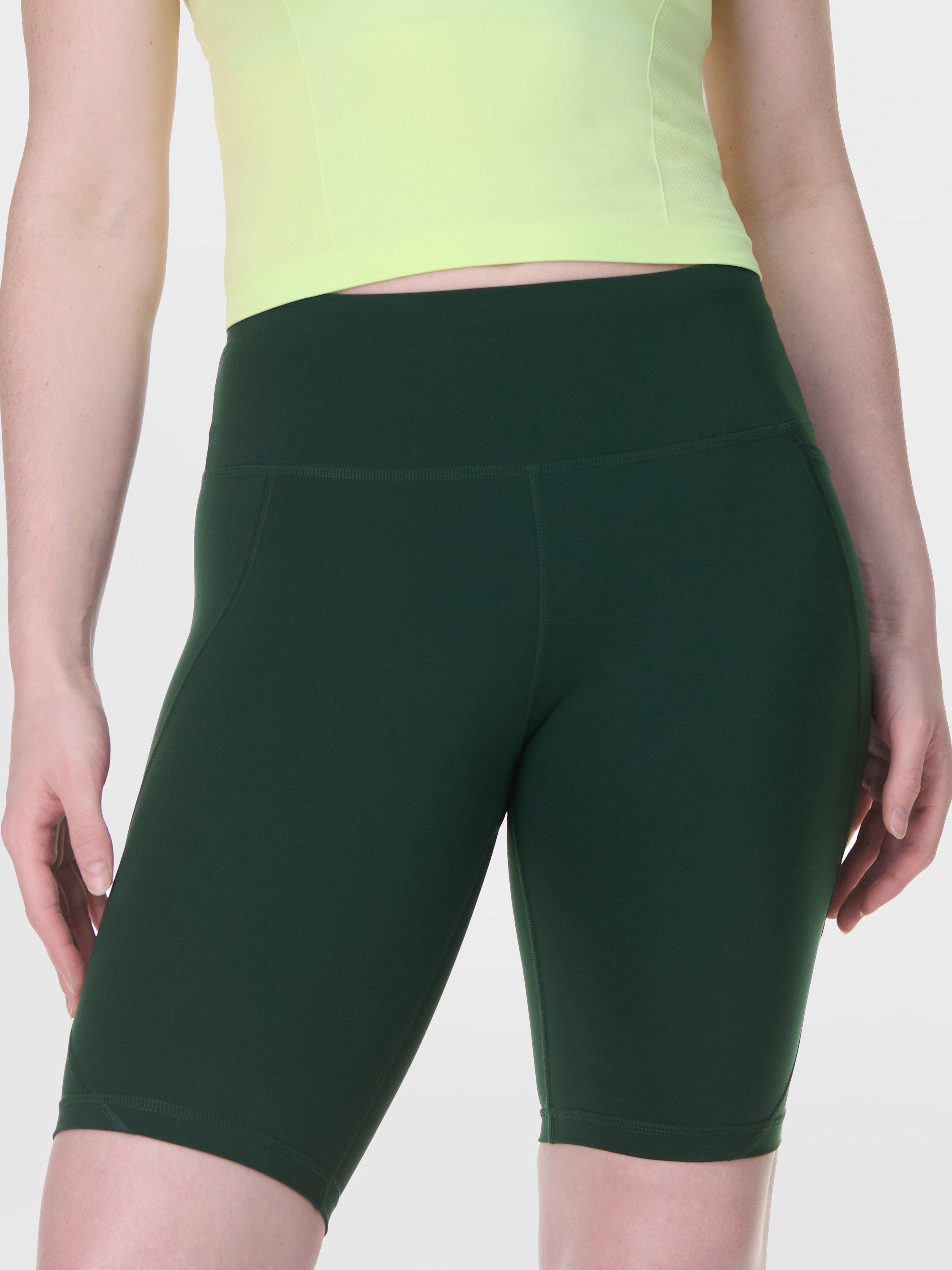 Product image 1 of 8, which shows Sweaty Betty Power 9" Biker Shorts, Cedar Green, XXS