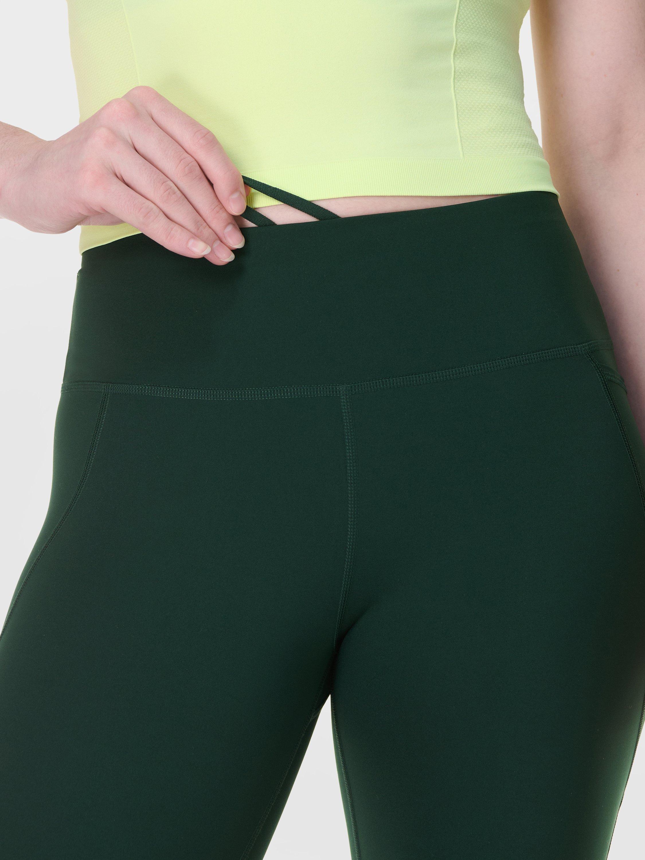 Product image 5 of 8, which shows Sweaty Betty Power 9" Biker Shorts, Cedar Green, XXS