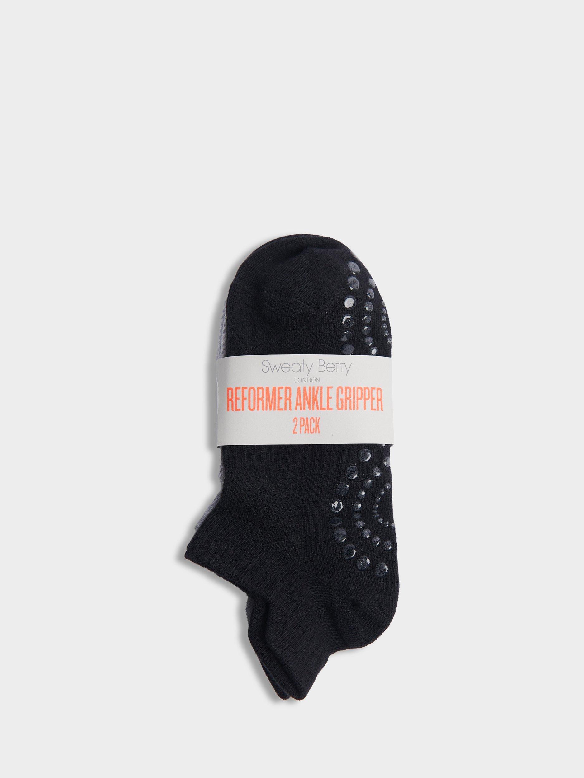Product image 2 of 3, which shows Sweaty Betty Reformer Gripped Organic Cotton Rich Trainer Socks, Pack of 2, Black/Grey, 2-5