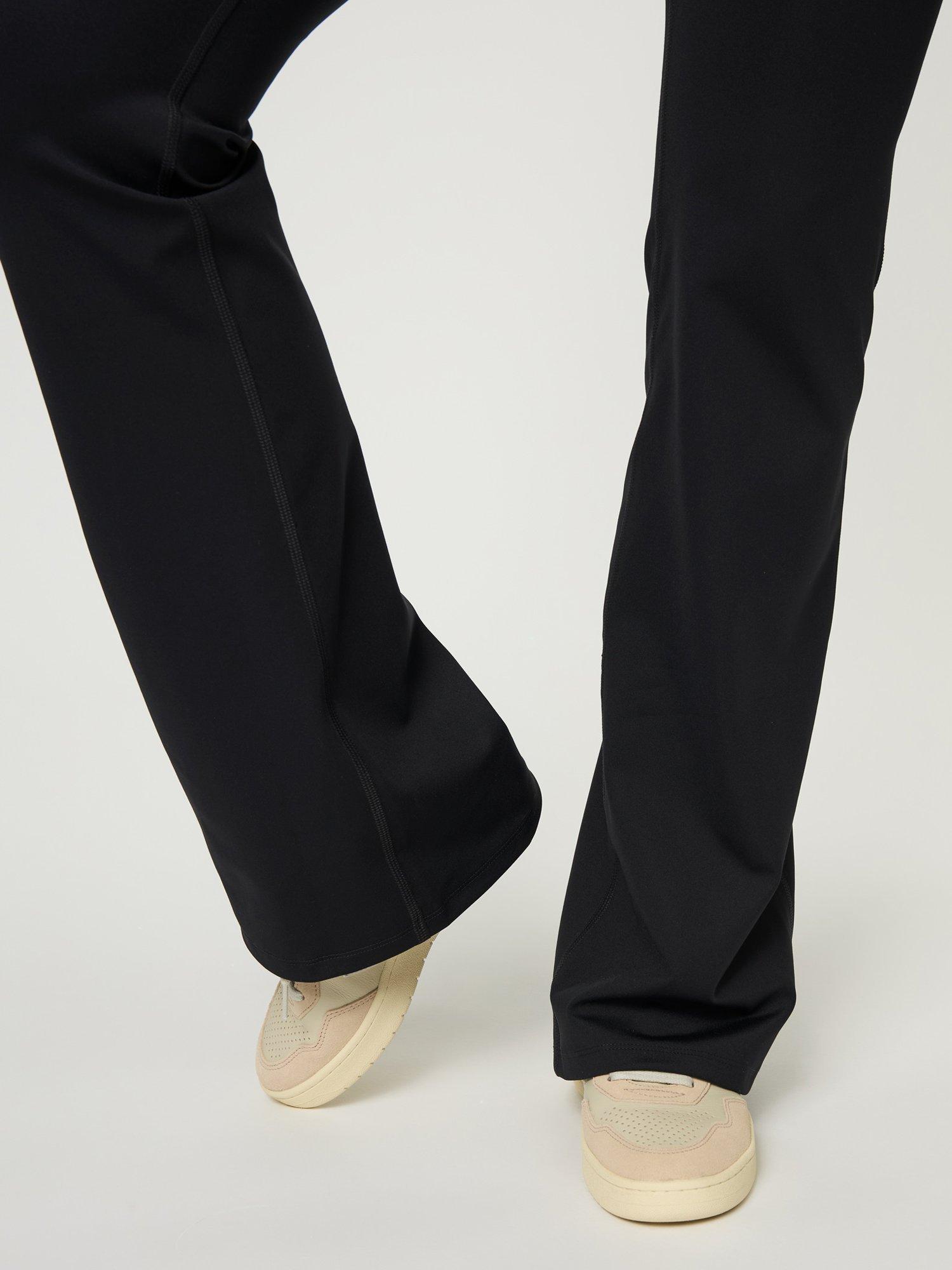Product image 4 of 6, which shows Girlfriend Collective High-Rise Compressive Flare Leggings, Black, 5XL